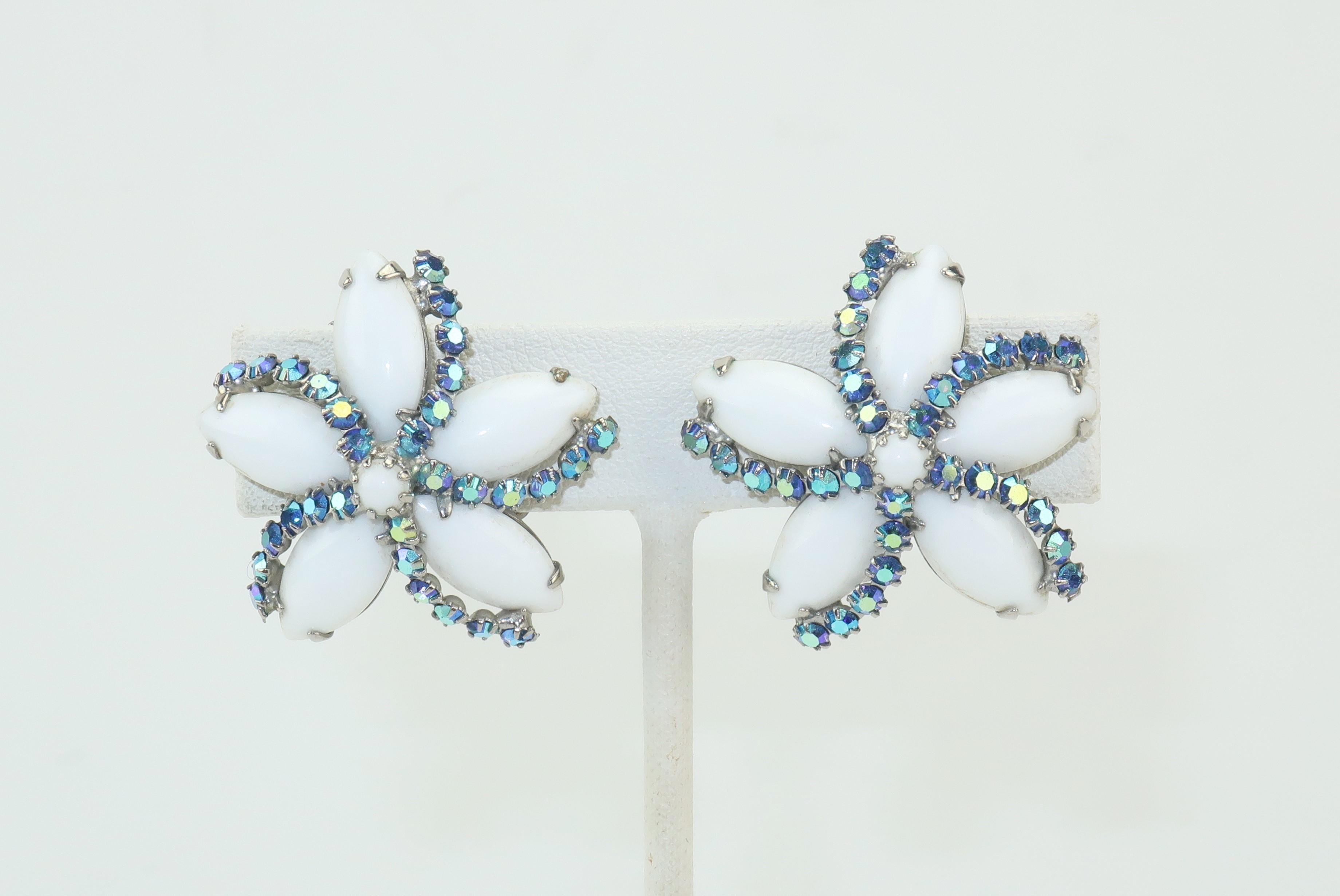 Sweet summery clip on earrings from Weiss in a starfish silhouette with milk glass cabochons and icy blue aurora borealis rhinestones.  Good vintage condition with a little glue residue barely visible on edges of some milk glass.
MEASUREMENTS
Each