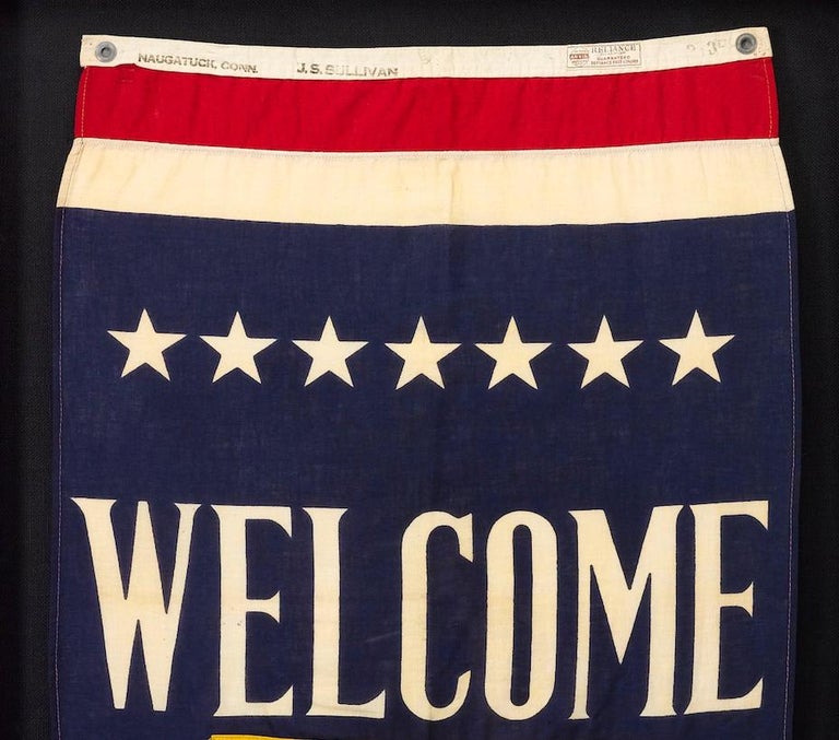 This is a beautifully preserved WWII Navy aircraft carrier banner, emblazoned with a welcome for the ship's firemen. Thirteen white stars feature in this patriotic piece of WWII and Navy history. 

The banner is partially printed and has hand-sewn