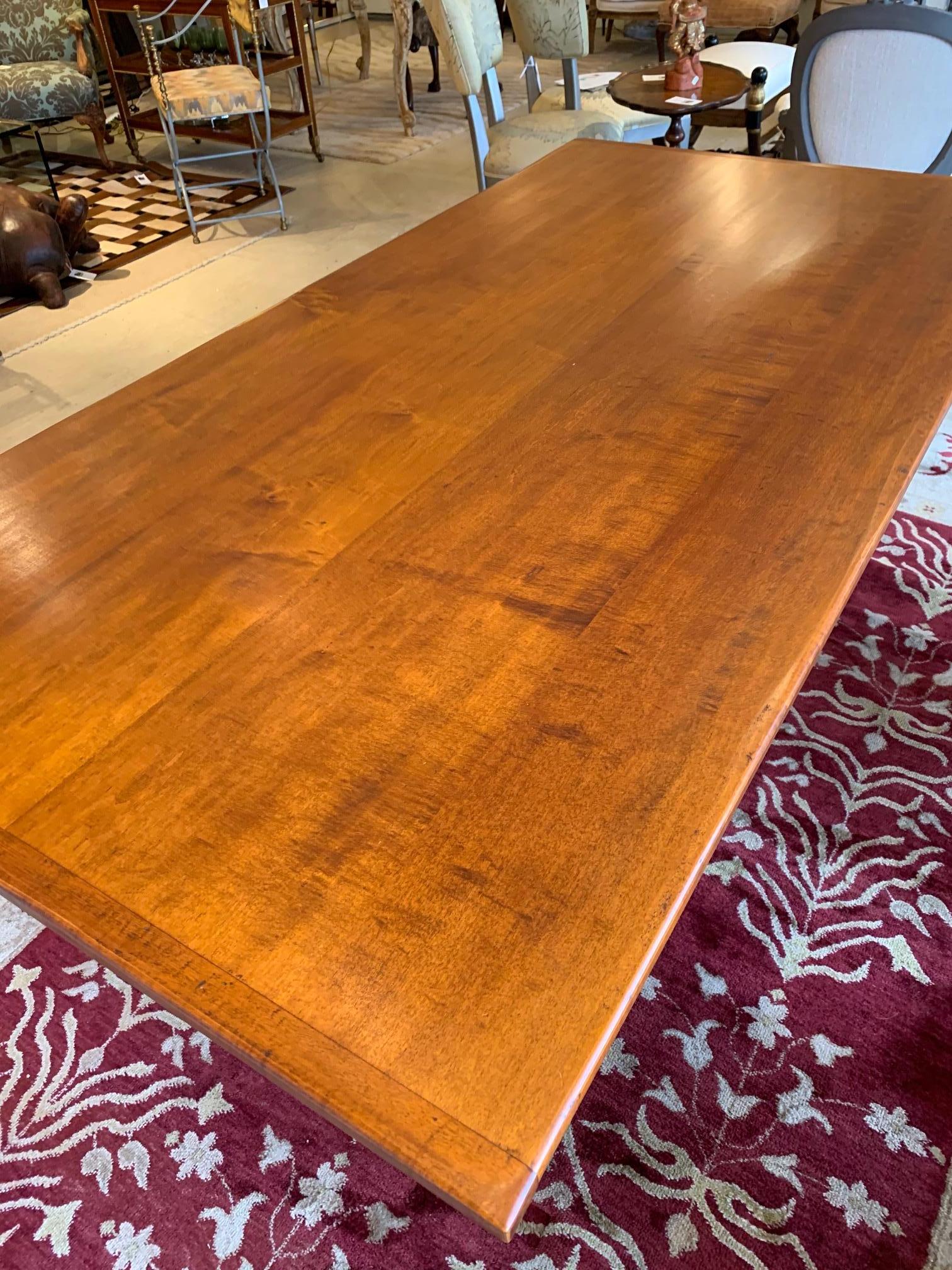 Handsome artisan handmade farmhouse table inspired by the William & Mary style having warm maple top and grey blue painted base with turned legs and center stretcher.