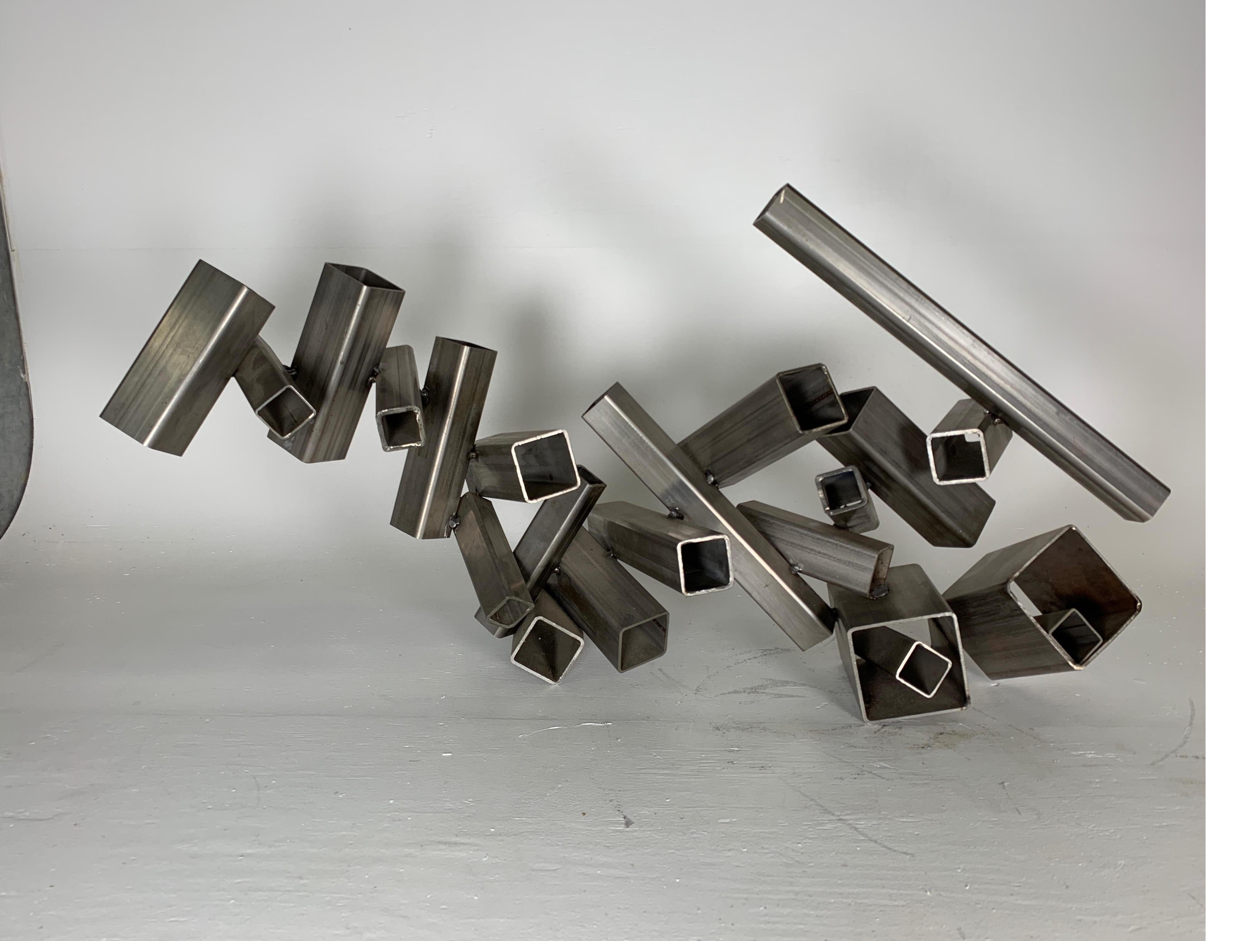 Large table sculpture in welded steel by David Phillips, acquired from collection of the artist.

Trained as an architect at Penn State in the 1960s, David Phillips has had a long and productive relationship with sculpture. From the 1970s until