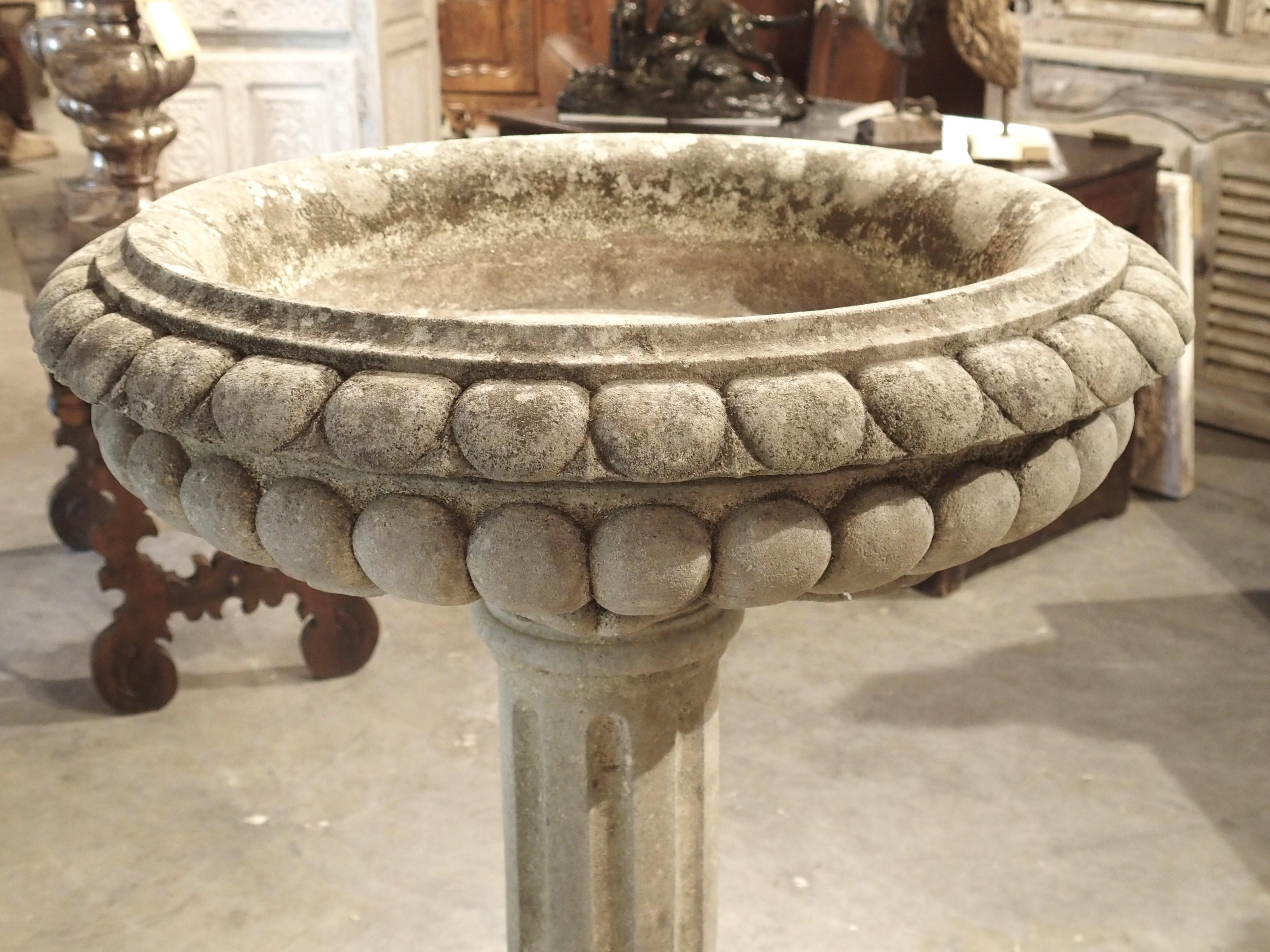 Standing over 45 inches tall, this well-carved limestone planter or fountain element would have a commanding presence in any landscape installation. Hand-carved in Italy in two sections (the basin is separate from the column/plinth section), a