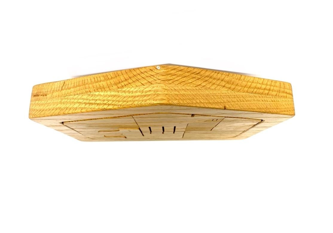 A well crafted and thick solid Oak Table Puzzle with anthropomorphic fitted elements housed in a stylized Barn style tray. Blocky Animal forms interlock creating a sculptural and decorative piece. The well finished pieces are pleasant to handle and