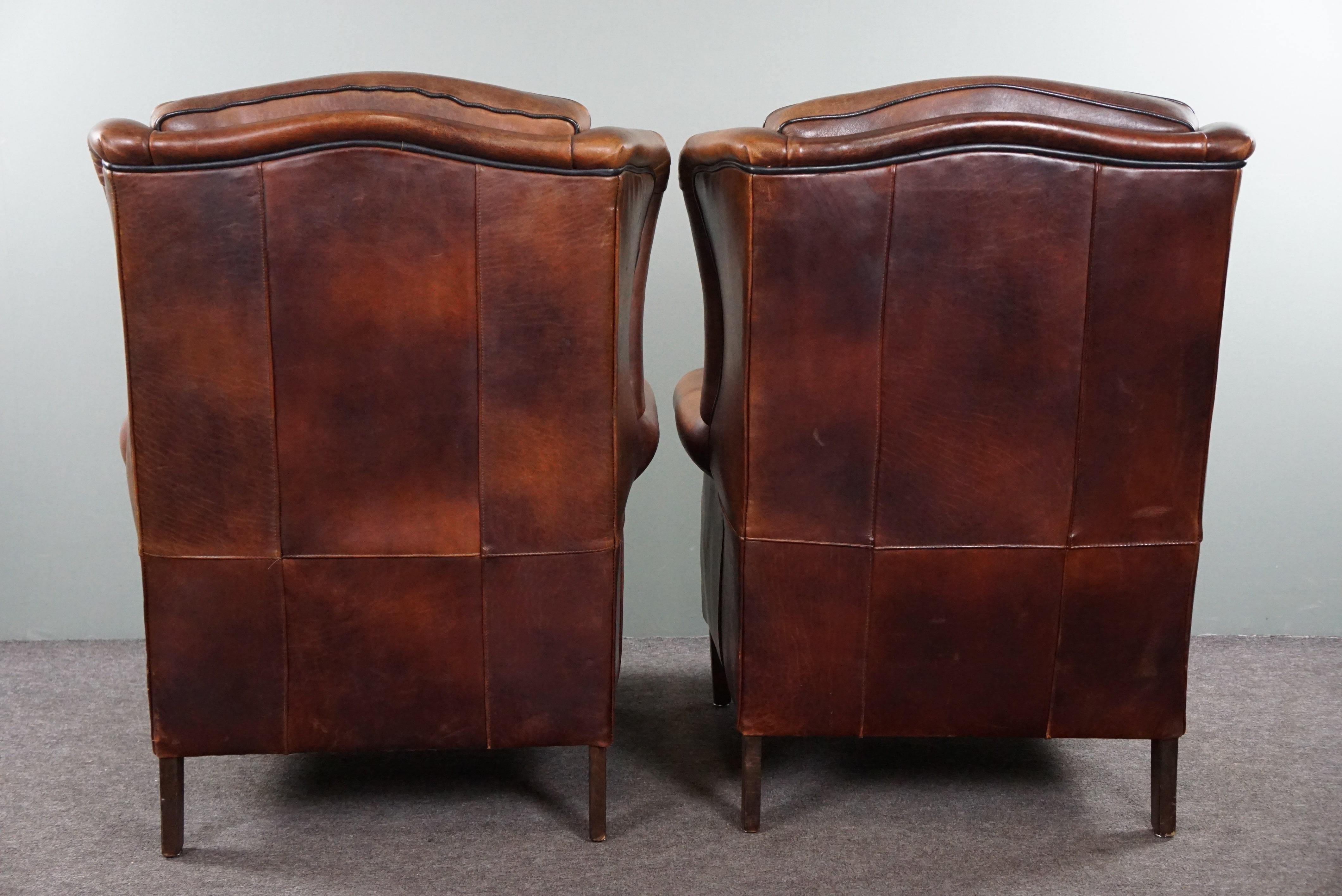 Dutch Well-fitting set of 2 sheep leather wing chairs For Sale