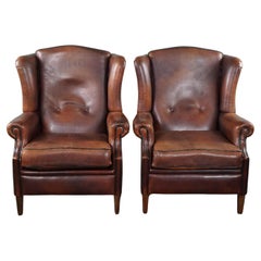Well-fitting set of 2 sheep leather wing chairs