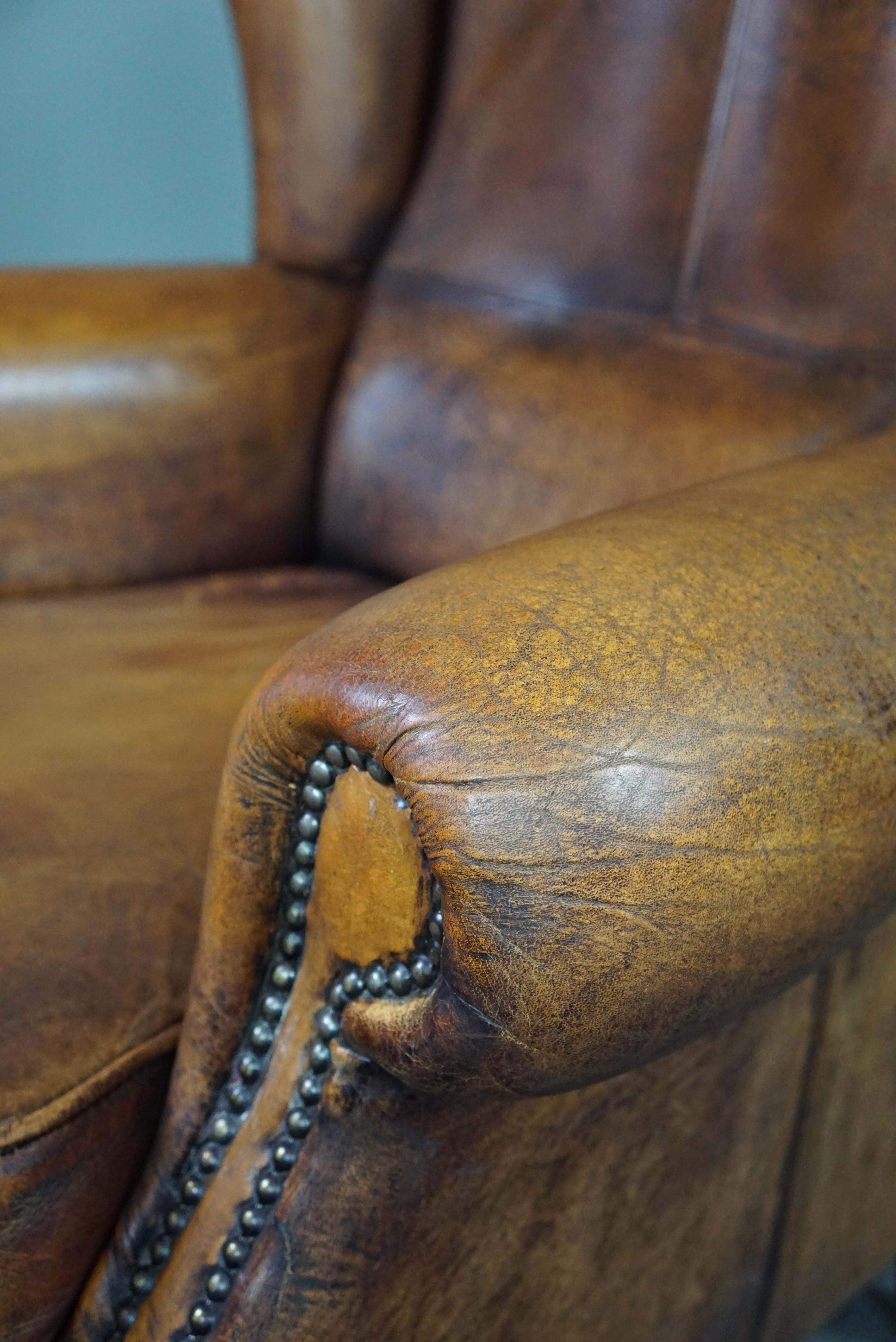 Well-fitting sheepskin leather wing chair For Sale 3