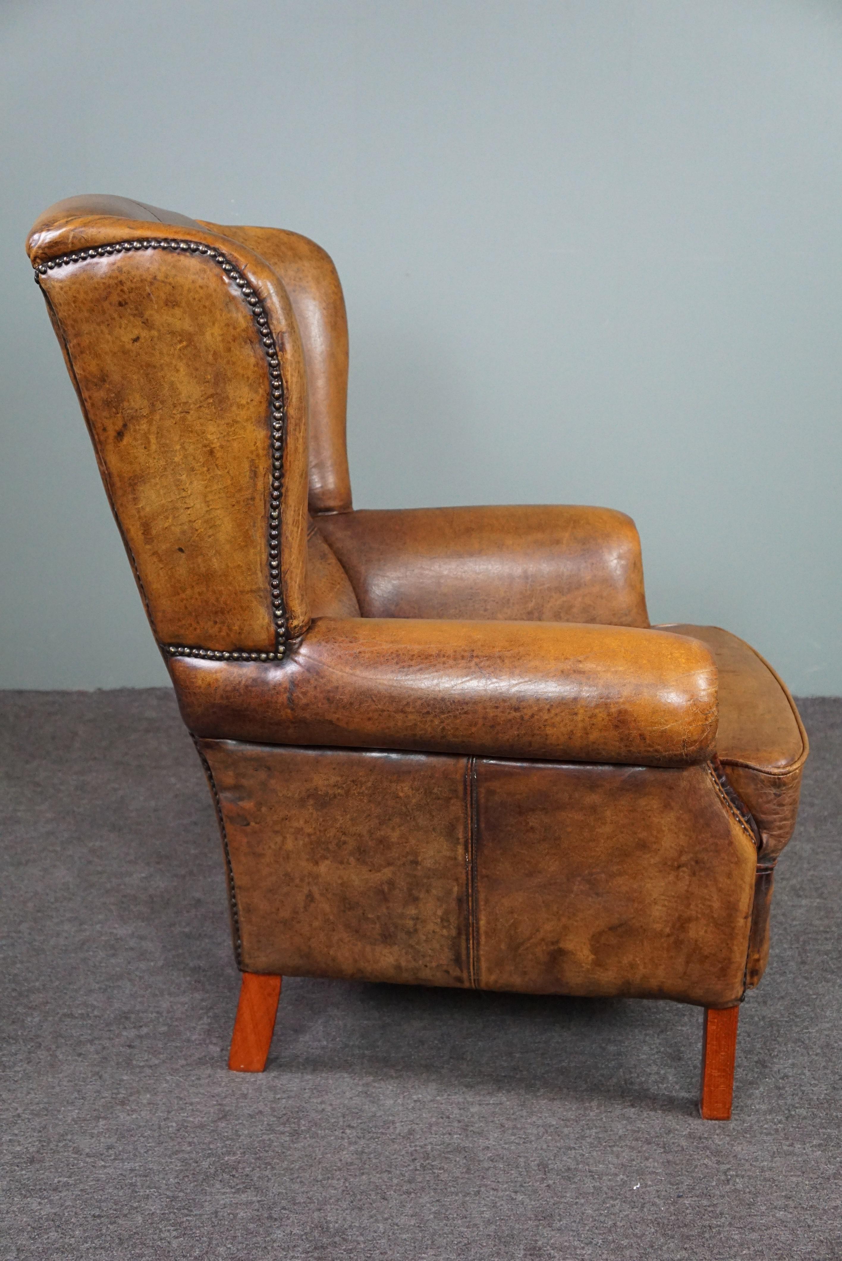 Dutch Well-fitting sheepskin leather wing chair For Sale
