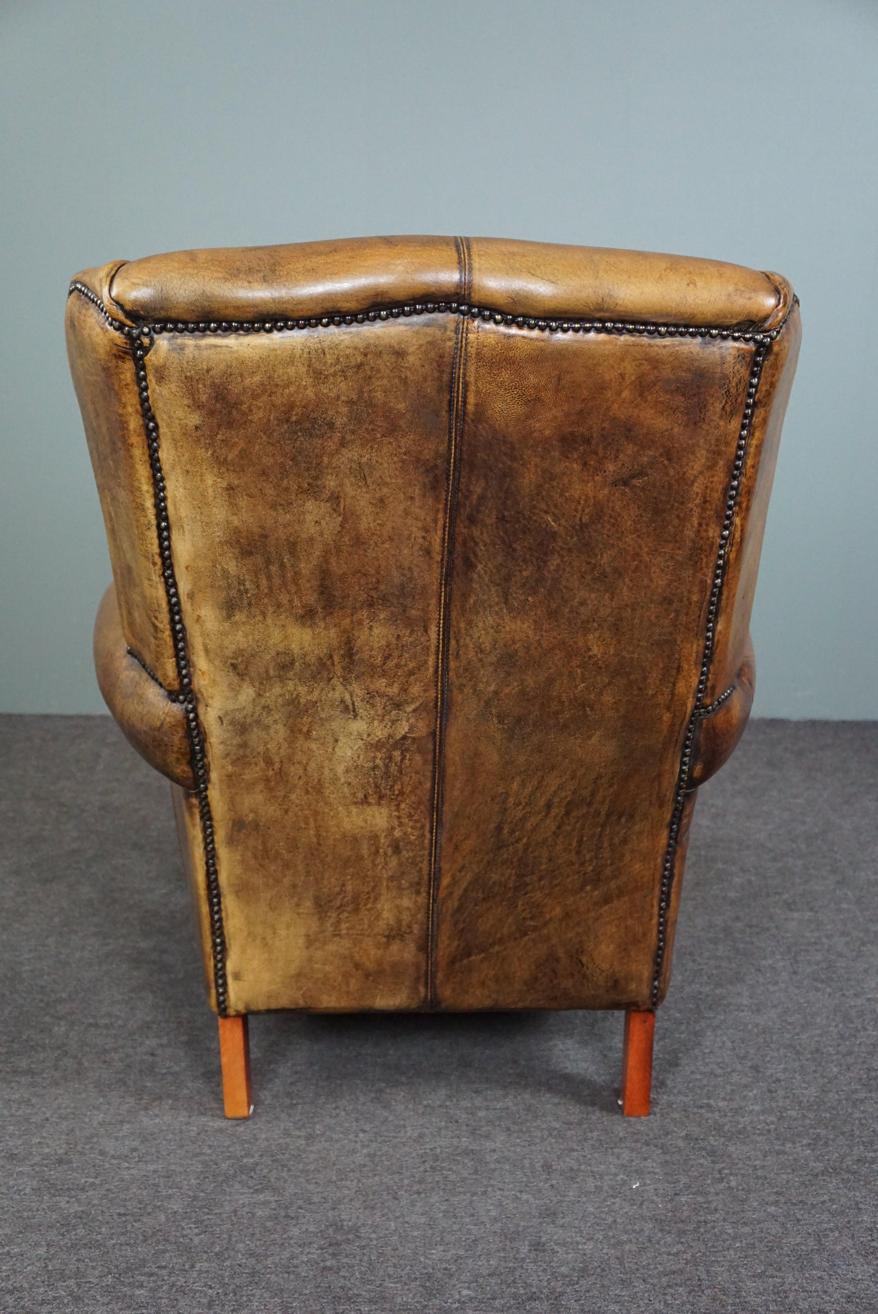 Hand-Crafted Well-fitting sheepskin leather wing chair For Sale