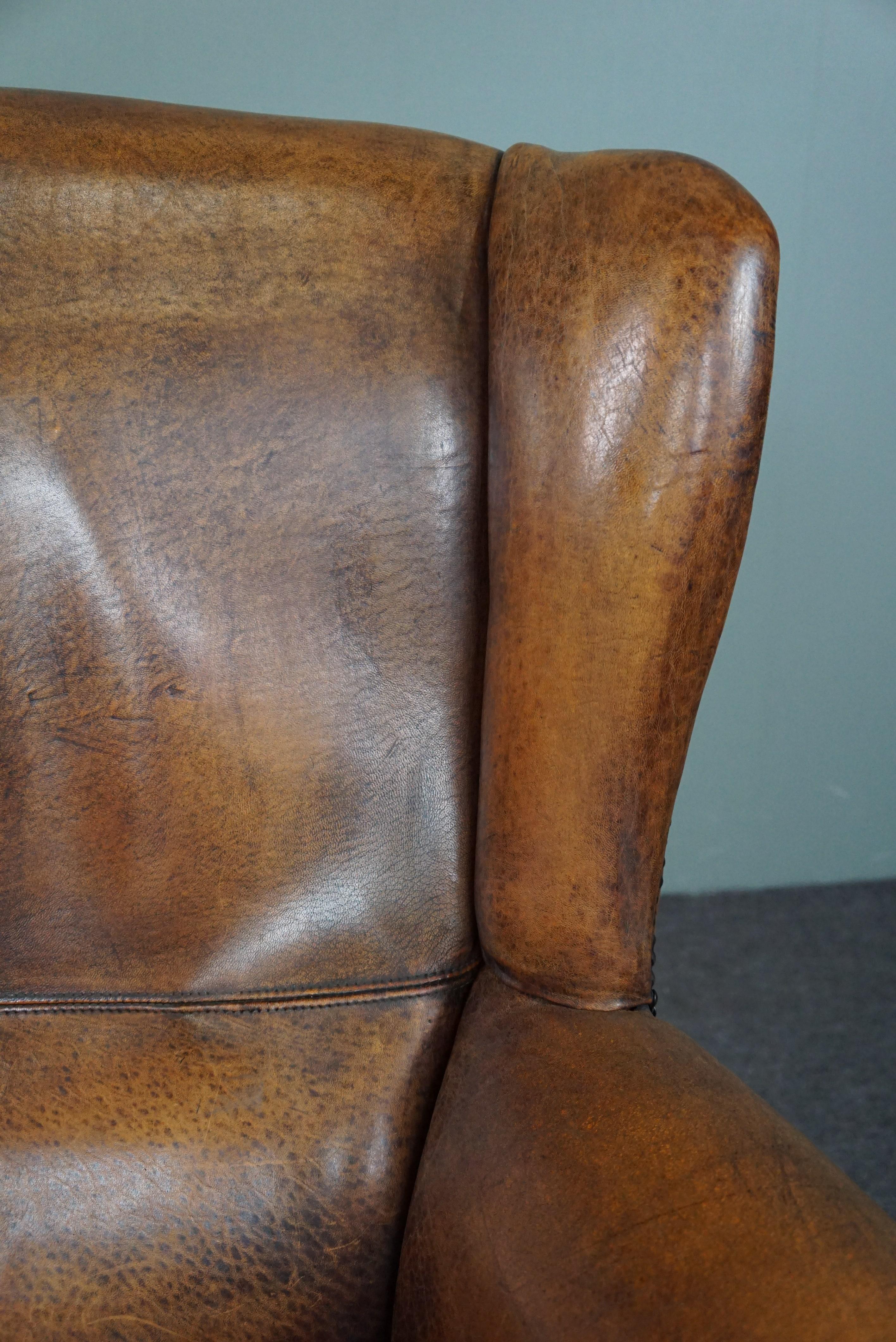 Well-fitting sheepskin leather wing chair For Sale 1