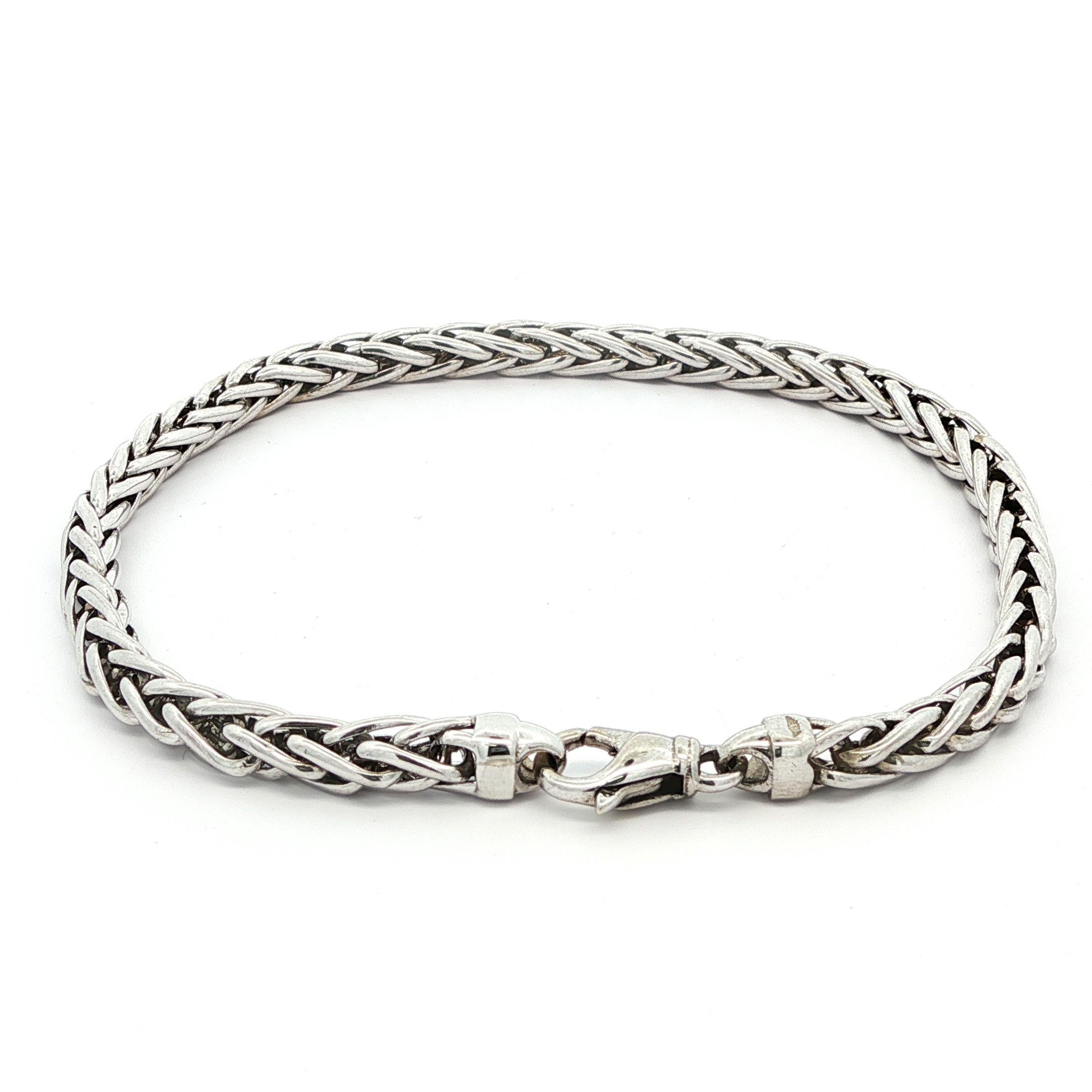 Material: Solid 14k White Gold
Weight: 15.94 Grams
Chain Type: 4mm Wheat link chain
Chain Length: 8.0