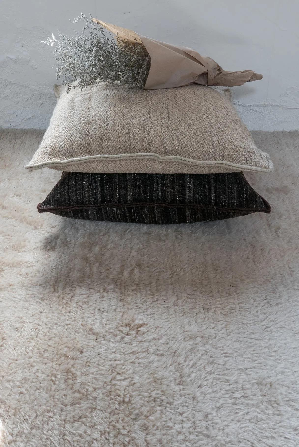 'Wellbeing' heavy kilim cushion by Ilse Crawford for Nanimarquina.

Executed in 100% hand-spun Afghan wool and filled with 100% cork, this cushion adds warmth, softness and comfort to any indoor setting. The 'Wellbeing' collection uses only