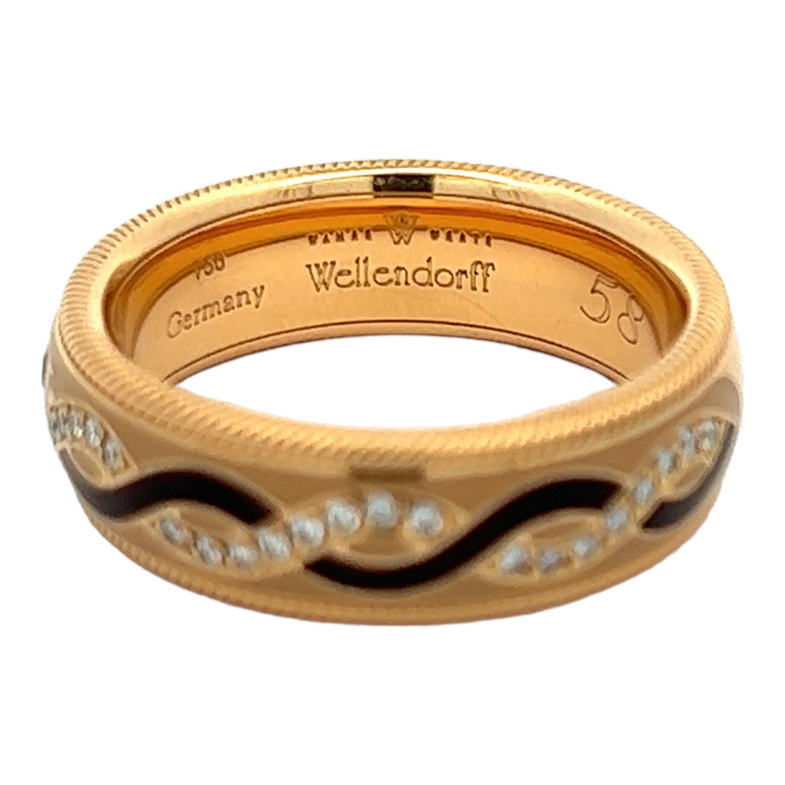 Beautifully crafted diamond and enamel spinner ring by German designer Wellendorf. The 18 karat yellow gold band features black enamel design interlocking with 42 round brilliant cut diamonds weighing approximately .33 carat total weight. Textured