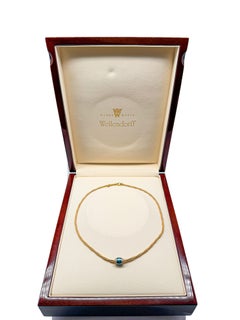 Pendentif et médaille en or jaune 18 carats Wellendorff