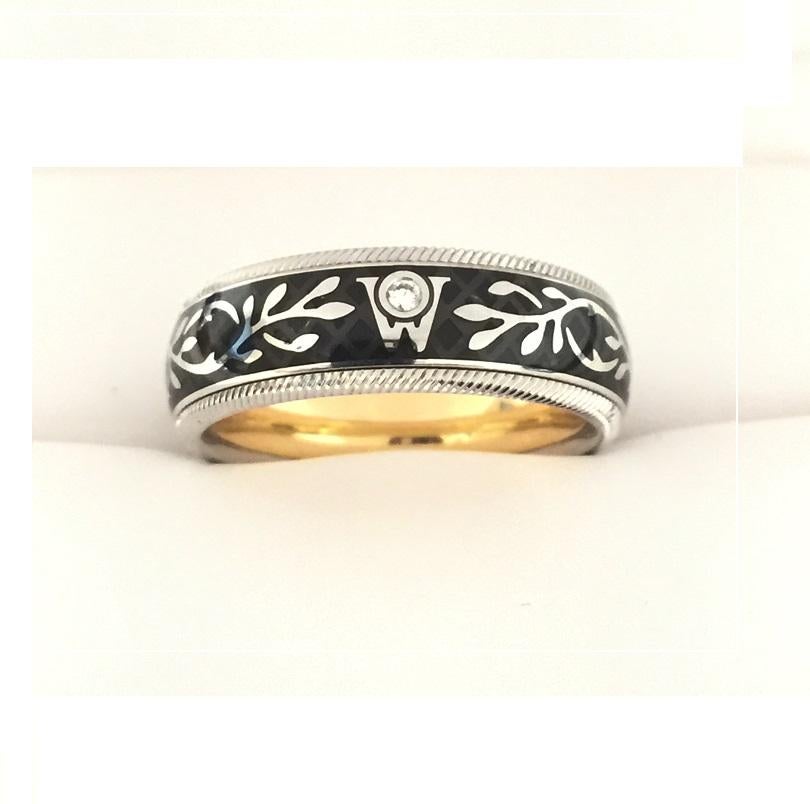 18k White and Yellow Gold 
Black Enamel 
Diamond 0.02ctw 
Size 56
Special features: 	
Ring is rotatable 
66679BL