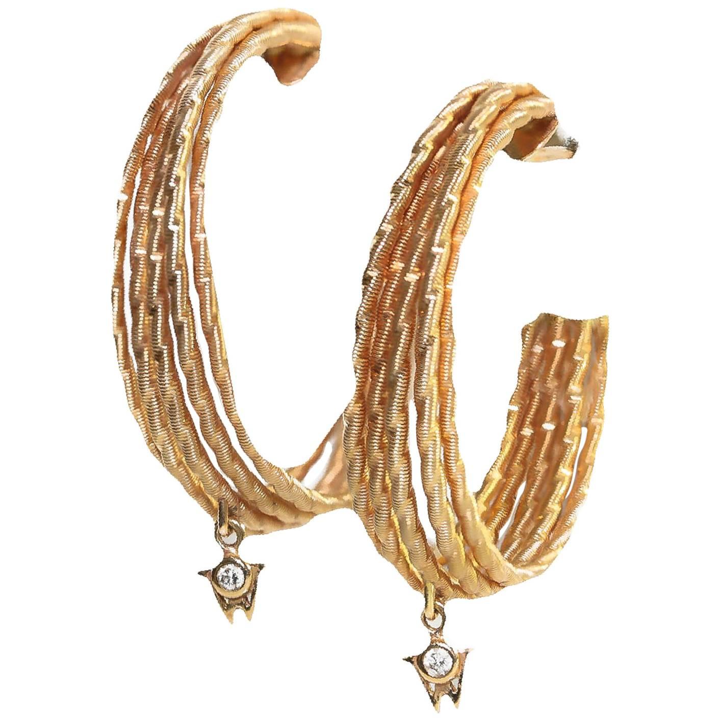 Wellendorff Brilliance of the Sun 18K yellow gold hoop earrings. Each Wellendorff logo is set with a small diamond.
Retail $ 9,200.00