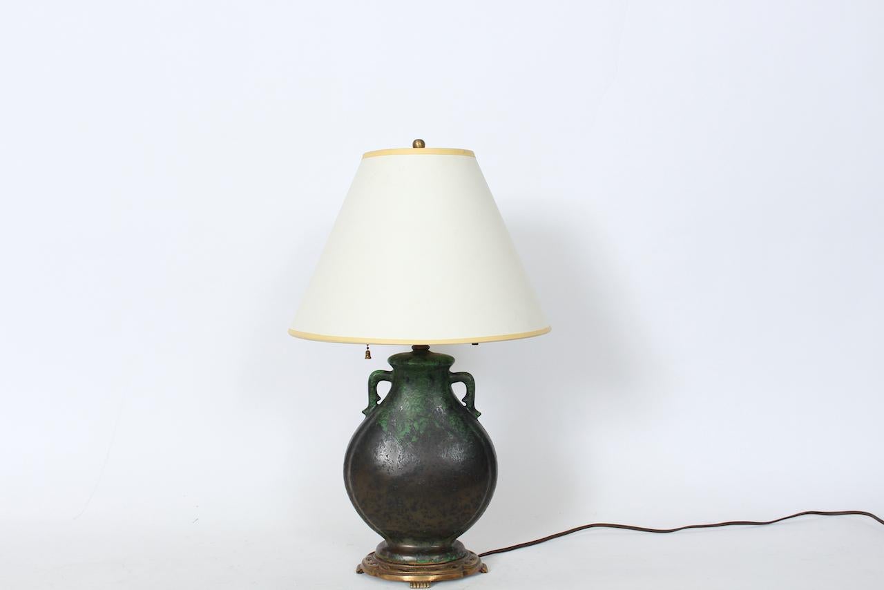 Early 20th Century Arts & Crafts Weller Pottery Coppertone Bedside Lamp.  Featuring a handcrafted glazed pottery handled bulbous canteen form, graduating color from Green at top to Blackened Copper towards bottom, dark metal patina effect, Brass