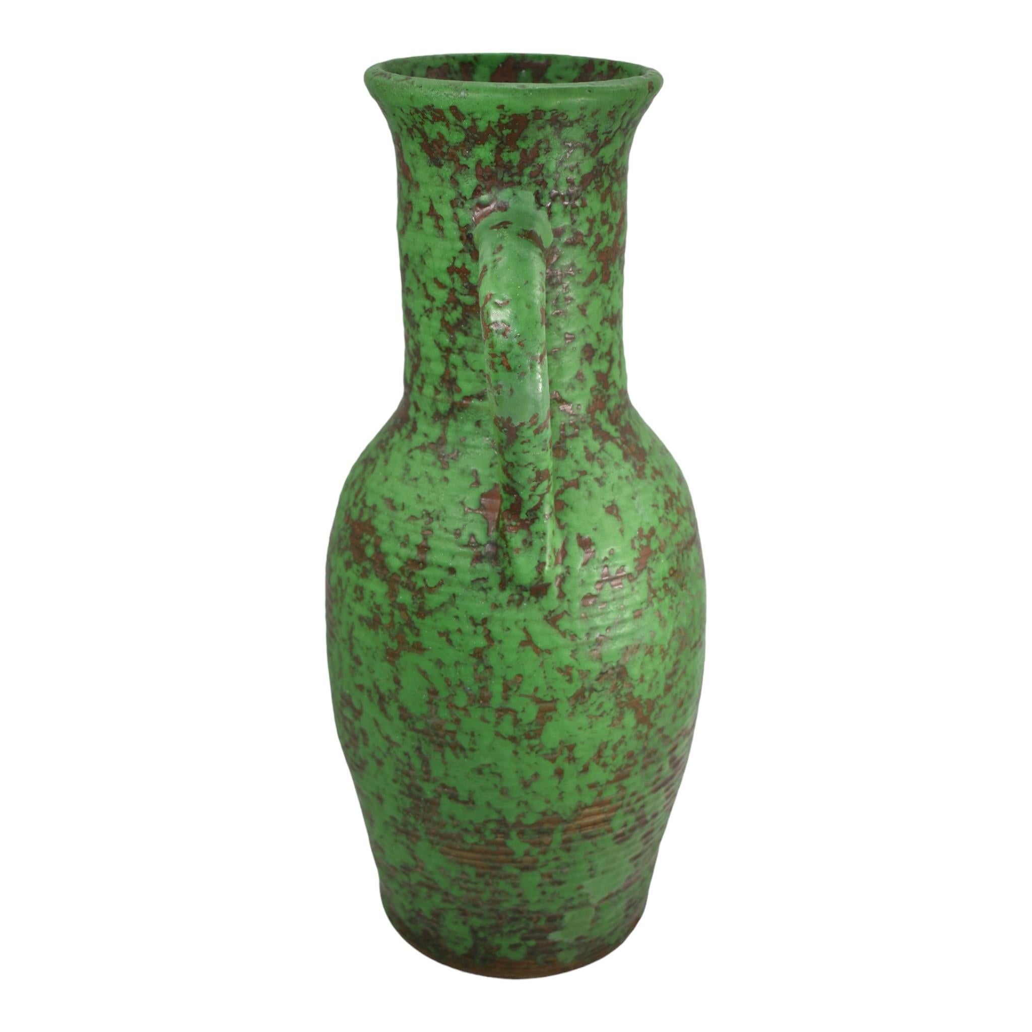 Weller Coppertone 1920s Vintage Arts and Crafts Pottery Green Ceramic Floor Vase
Massive hand thrown arts and crafts ribbed and handled form with super color.
Shows well with a professional non-showing restoration to the body. No other chips,