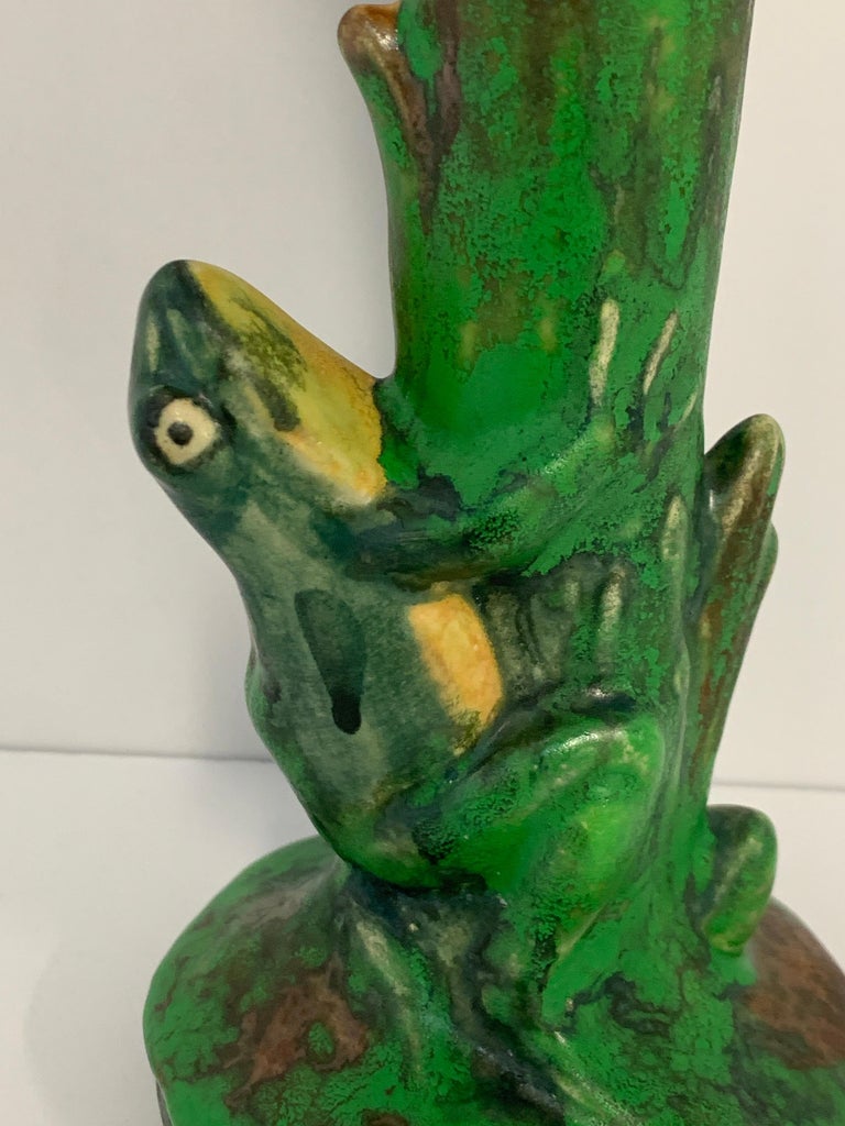 A pretty marked Weller vase in the Coppertone line depicting a frog. Quite cut. There is an old repair to the top of one flared edge, please see the detailed photo. Otherwise in good age appropriate condition, with minor imperfections. Artist