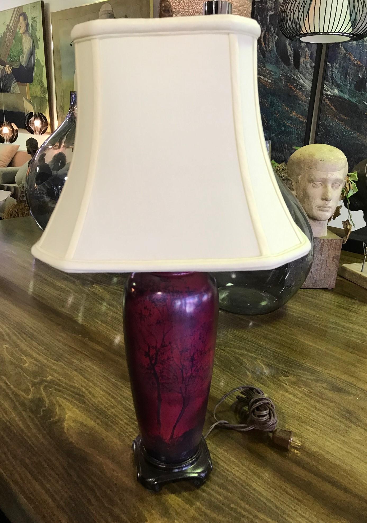 A wonderful lamp with shimmering rich colors. Finely painted. Would stand out in about any setting.

Dimensions of lamp: 23.5