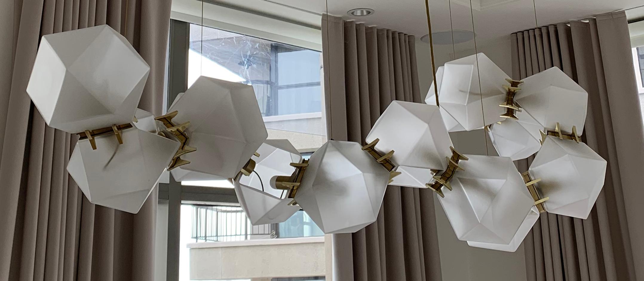 An 11-modular fixture inspired by jewellry, the Welles Glass series is the brand’s signature piece reinterpreted. The Welles Glass collection balances a geometric and multifaceted shape with a soft, frosted glass encased in satin metallic prongs.