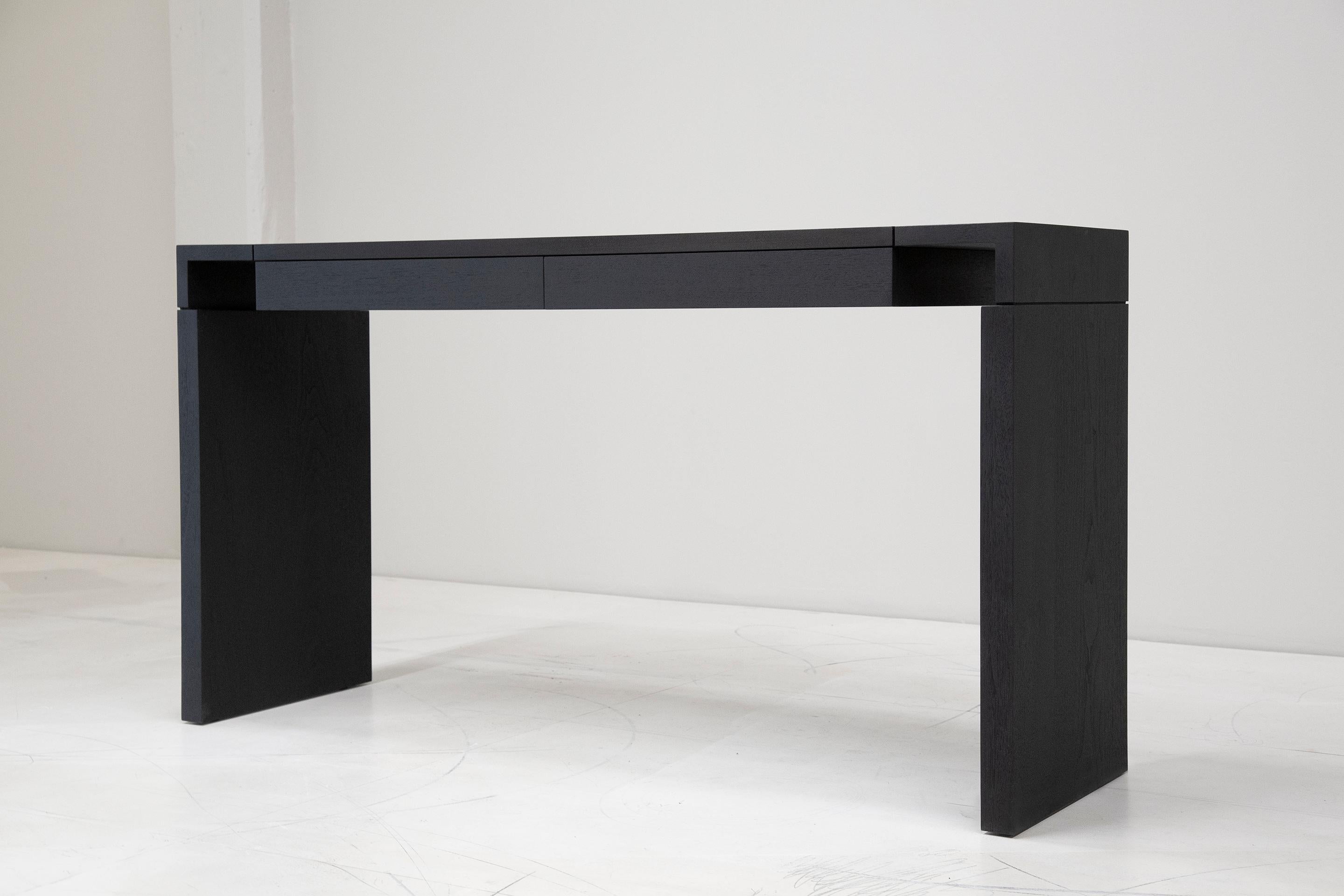 Made to order in Brooklyn, New York this customizable desk with drawer options is handmade of solid wood with meticulously cut finger joints as its unique design feature.   
Shown: 66