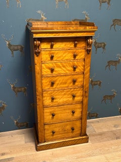 Wellington chest of drawers in satinwood with 7 drawers of increasing depth.