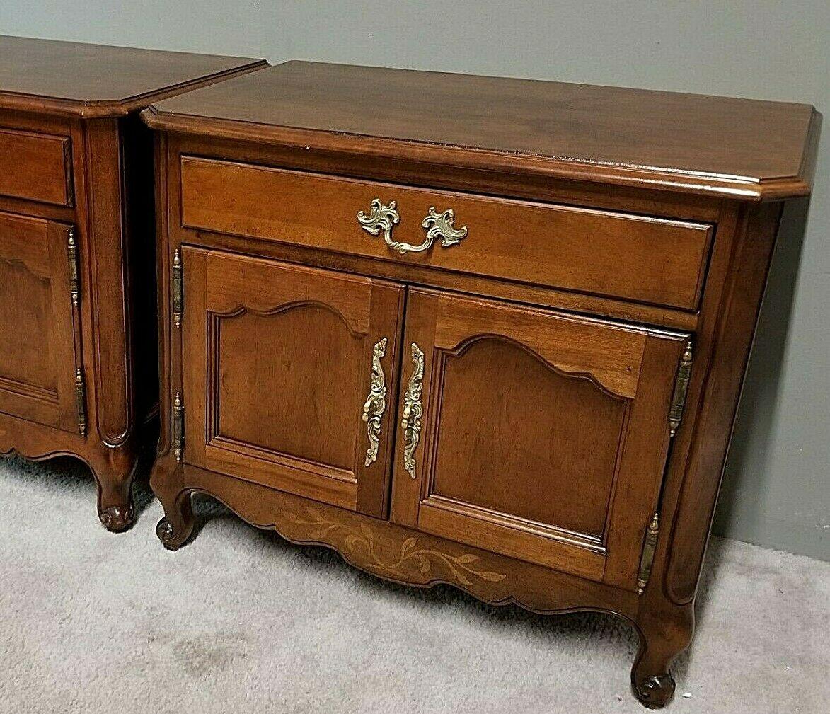 Pair of Wellington hall French provincial solid Mahogany nightstands

Approximate measurements in inches
24