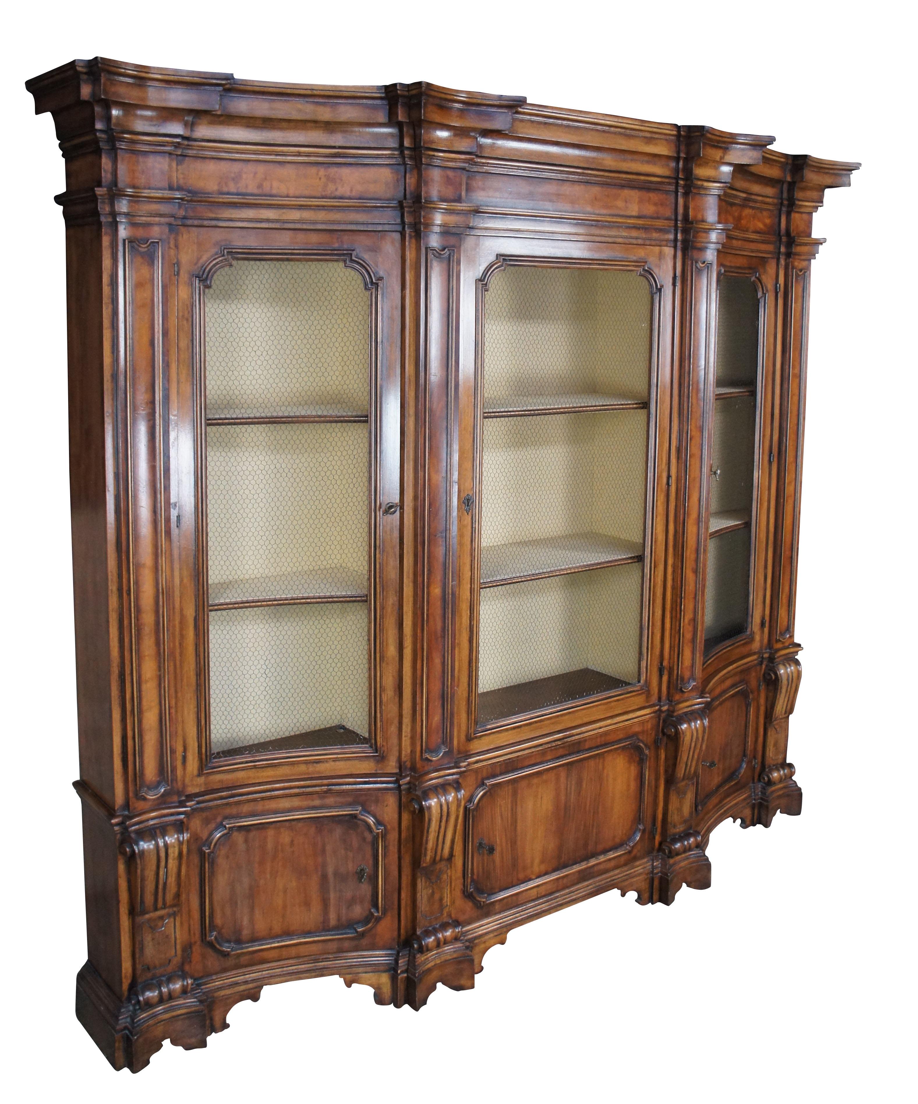 Mid century Wellington Hall breakfront library bookcase or china cabinet.  Handmade in Italy from Italian walnut featuring beautful columns, linen lined interior and chicken wire mesh doors.  Lower portion of the cabinet shwocases scrolled columns