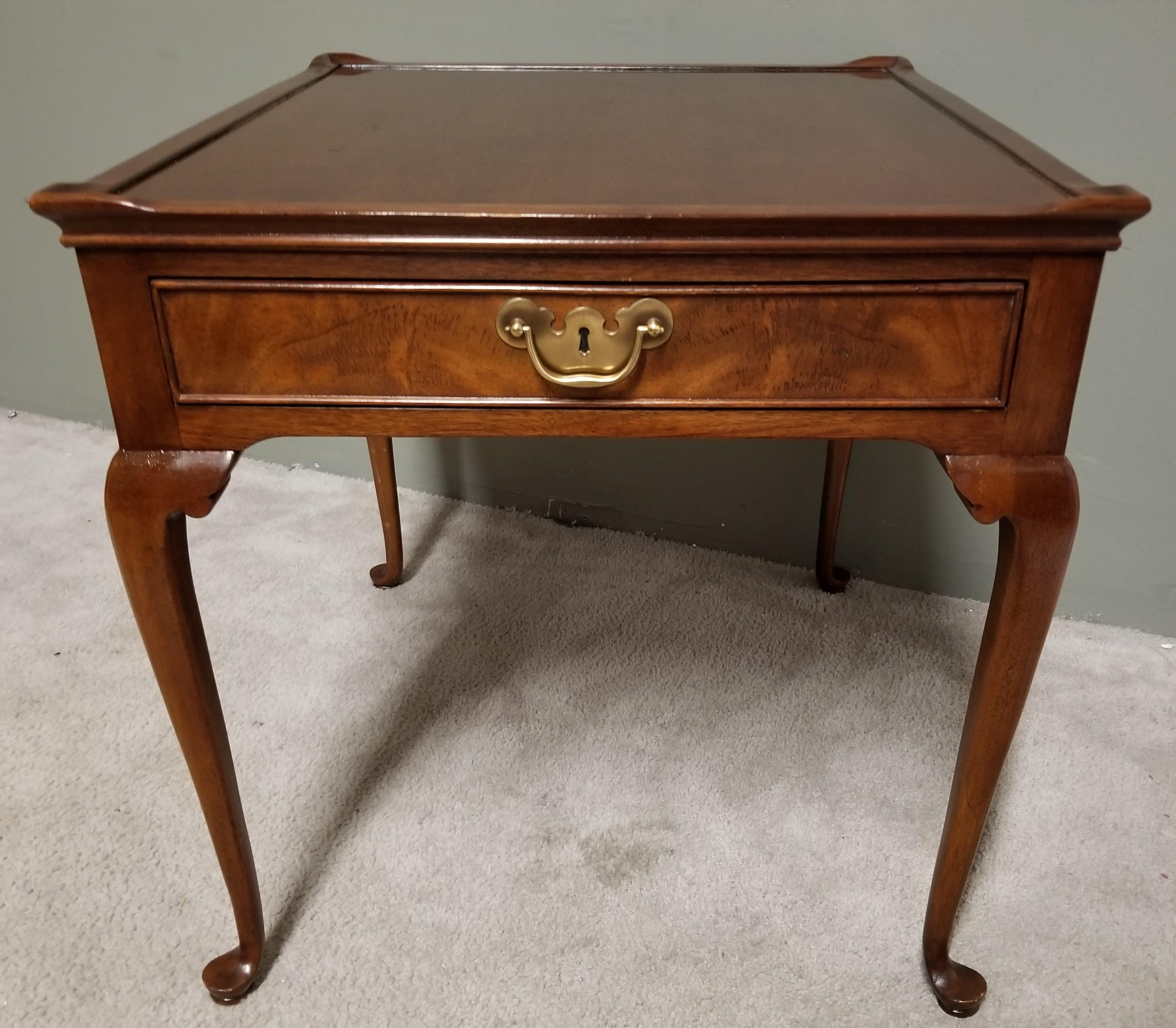 Offering one of our recent palm beach estate fine furniture acquisitions of a 
Classic Wellington Hall Queen Anne Mahogany End Side Table with Flame Mahogany Front Drawer

Approximate Measurements in Inches
24