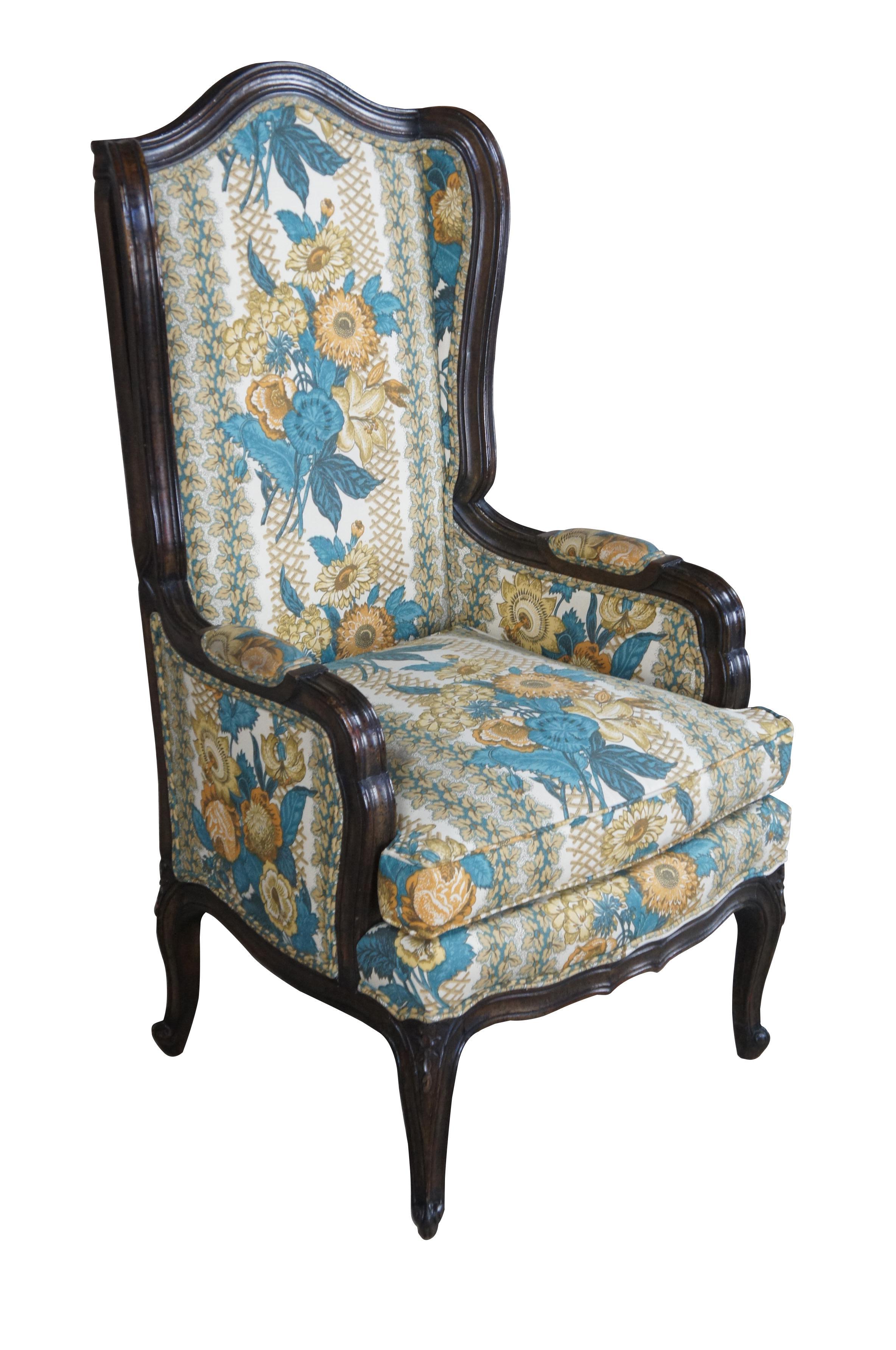 Vintage Wellington Hall floral upholstered fauteuil armchair.  Made of walnut featuring French styling with domed top with winged form, padded arms, serpentine accents and cabriole legs.  

Wellington Hall, Highpoint North Carolina, Founded