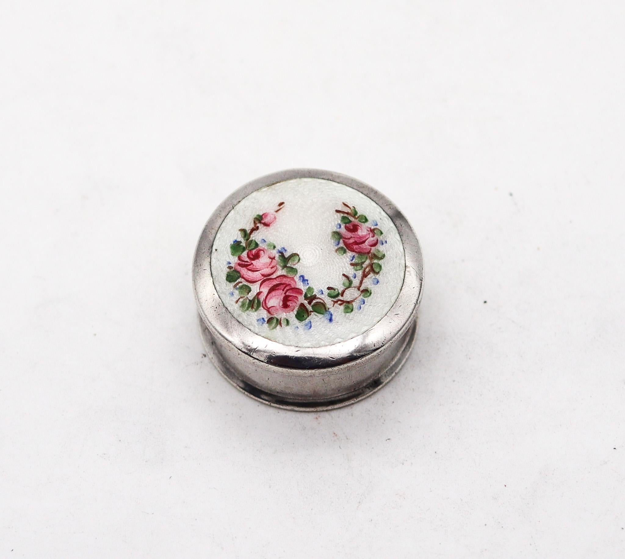 An art deco guilloche enamel pill box made by Wells & Company.

Beautiful enamel round pill box, created during the art deco period, back in the 1930. This beautiful antique piece was carefully crafted at the workshops of the Wells Company in solid