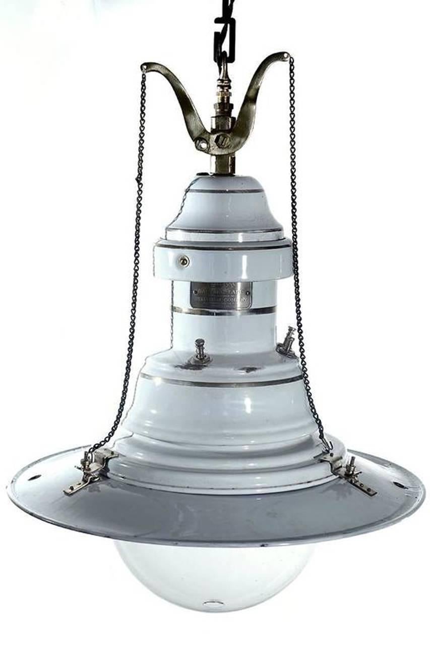 You don't see these unique gas arc lamps too often. This example in nice condition including the original glass dome. It has been converted to accept three standard bulbs.