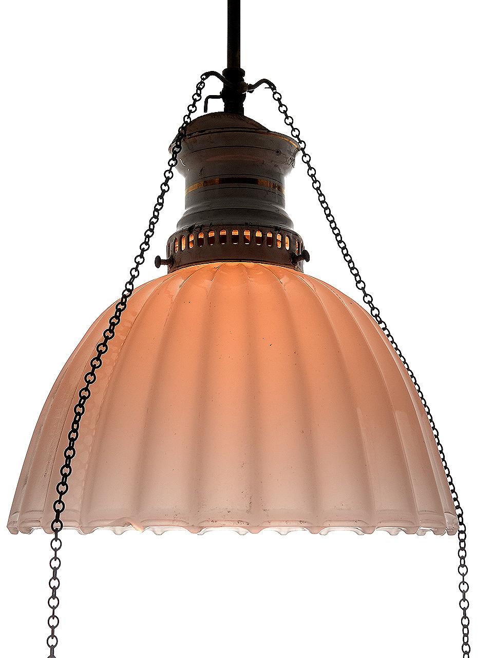 This is a nice, simple and elegant early gas pendent. It has been wired to now take a standard E12 bulb retaining the original look. The large fluted clam broth glass shade has an 11 inch diameter. The crown is white porcelain with gold accents and