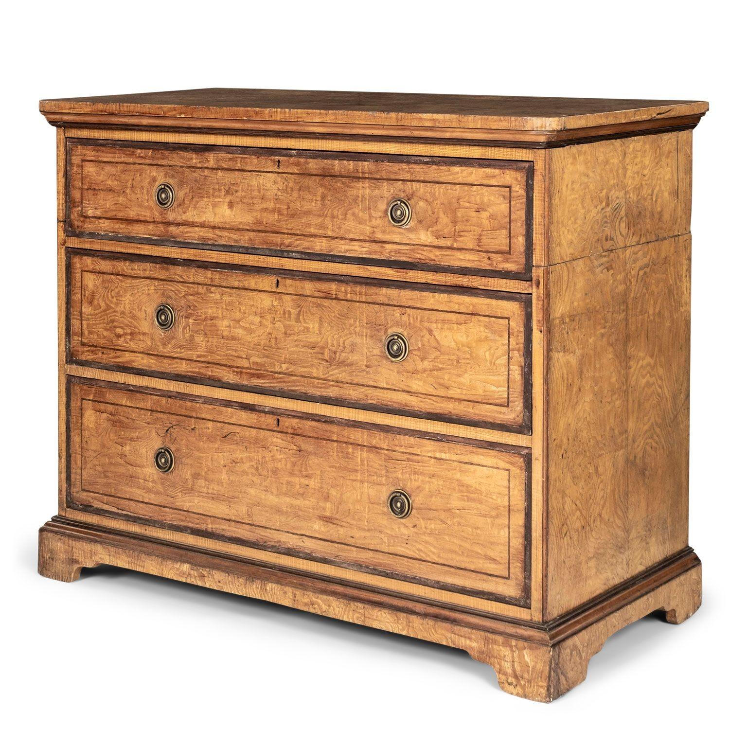 Welsh burl ash chest circa 1820-1849, with three graduated drawers and bracket feet. Constructed with mortise and tenon joints and dovetailed drawers. Ring pulls. Gorgeous decorative burl wood grain.
