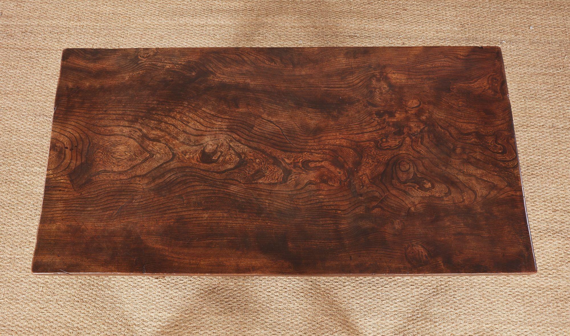 Timber! It's all about the grain, and this outstanding 18th century Welsh farm table with a top made of a single thick plank of elm is hard to match. Detachable top over oak base having square tapered legs joined by 