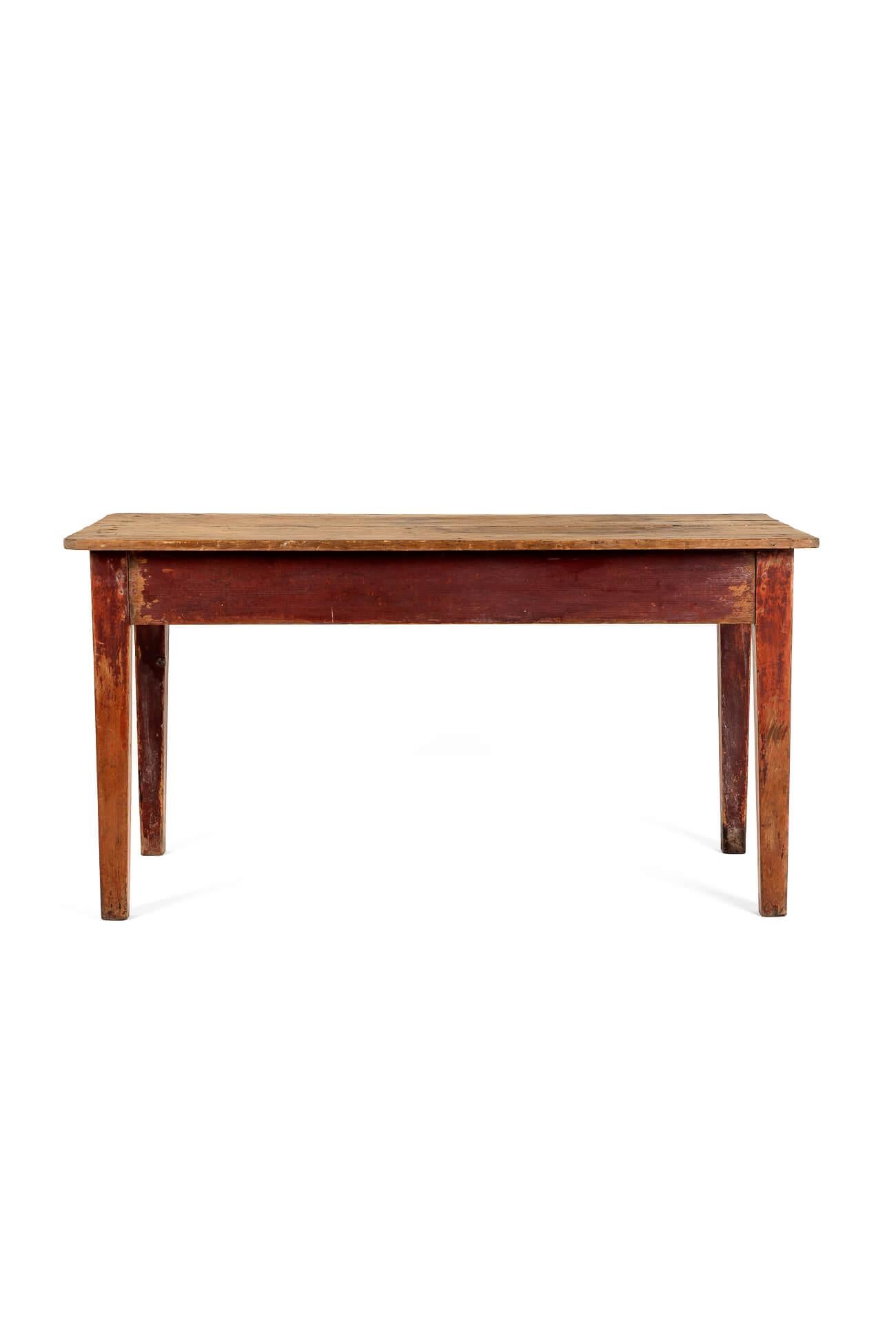A wonderful pine scrub top table with a generous characterful three plank top.

The base shows remnants of the original ochre coloured paint to the peripheral apron and gently tapering legs.

A real gem of a table with plenty of original features