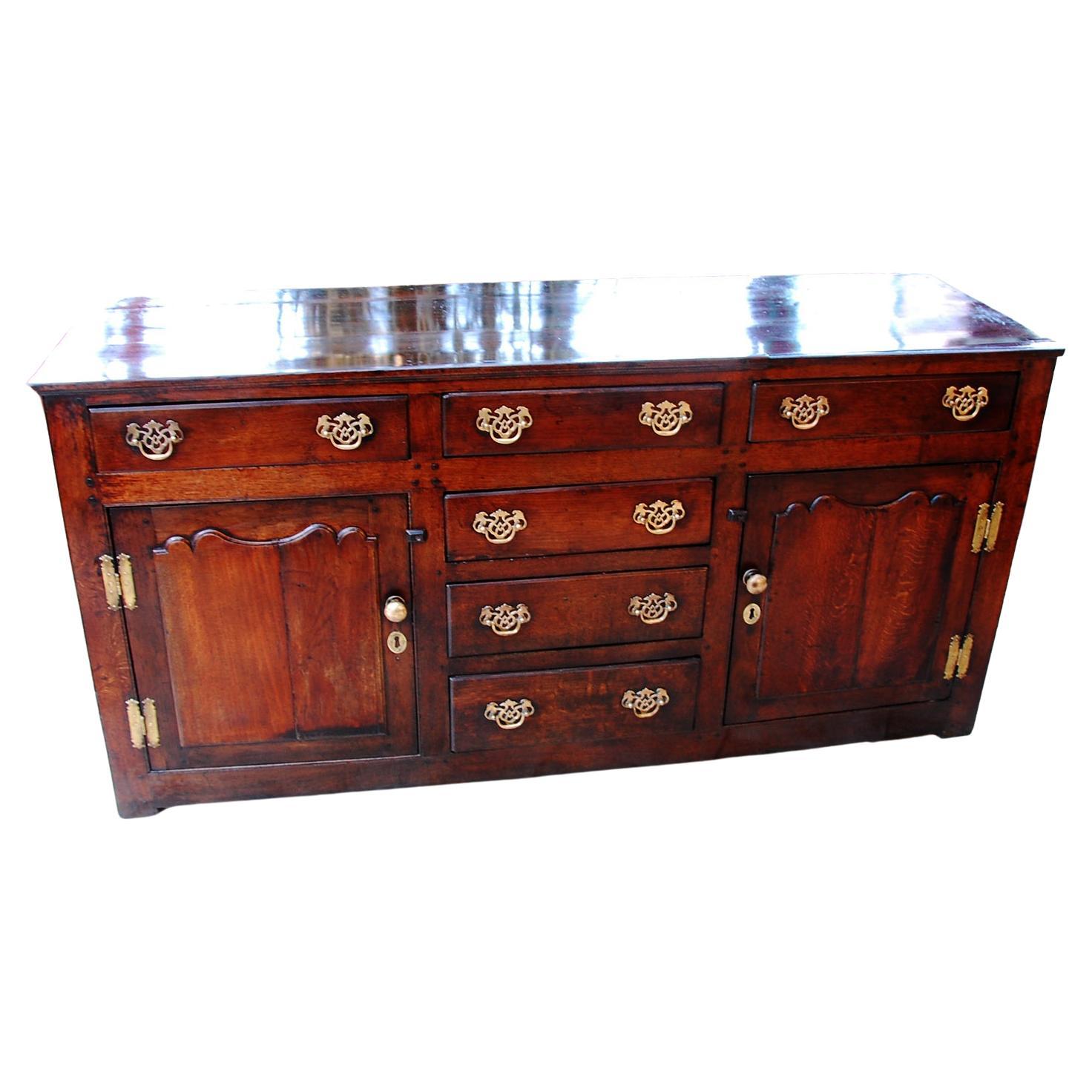 Welsh Georgian Oak Low Dresser with Six Drawers and Two Paneled Door Cupboards  For Sale
