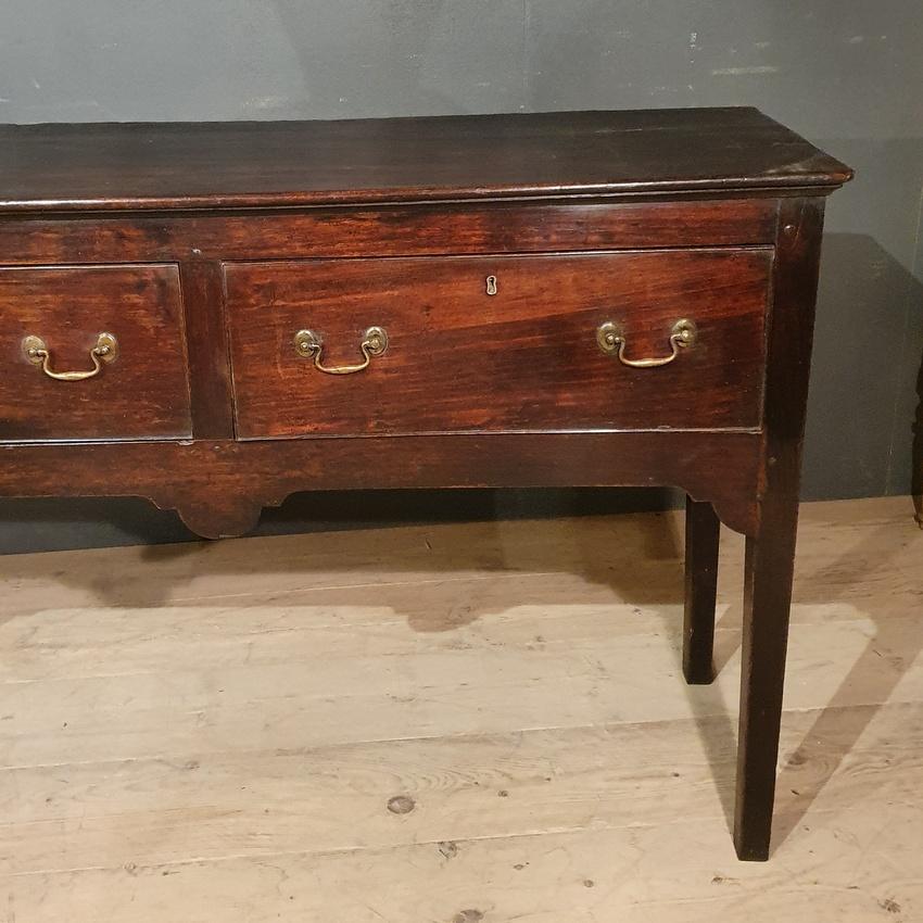 Long 18th century Welsh oak dresser base, 1790

Dimensions
81.5 inches (207 cms) wide
18.5 inches (47 cms) deep
35.5 inches (90 cms) high.

 