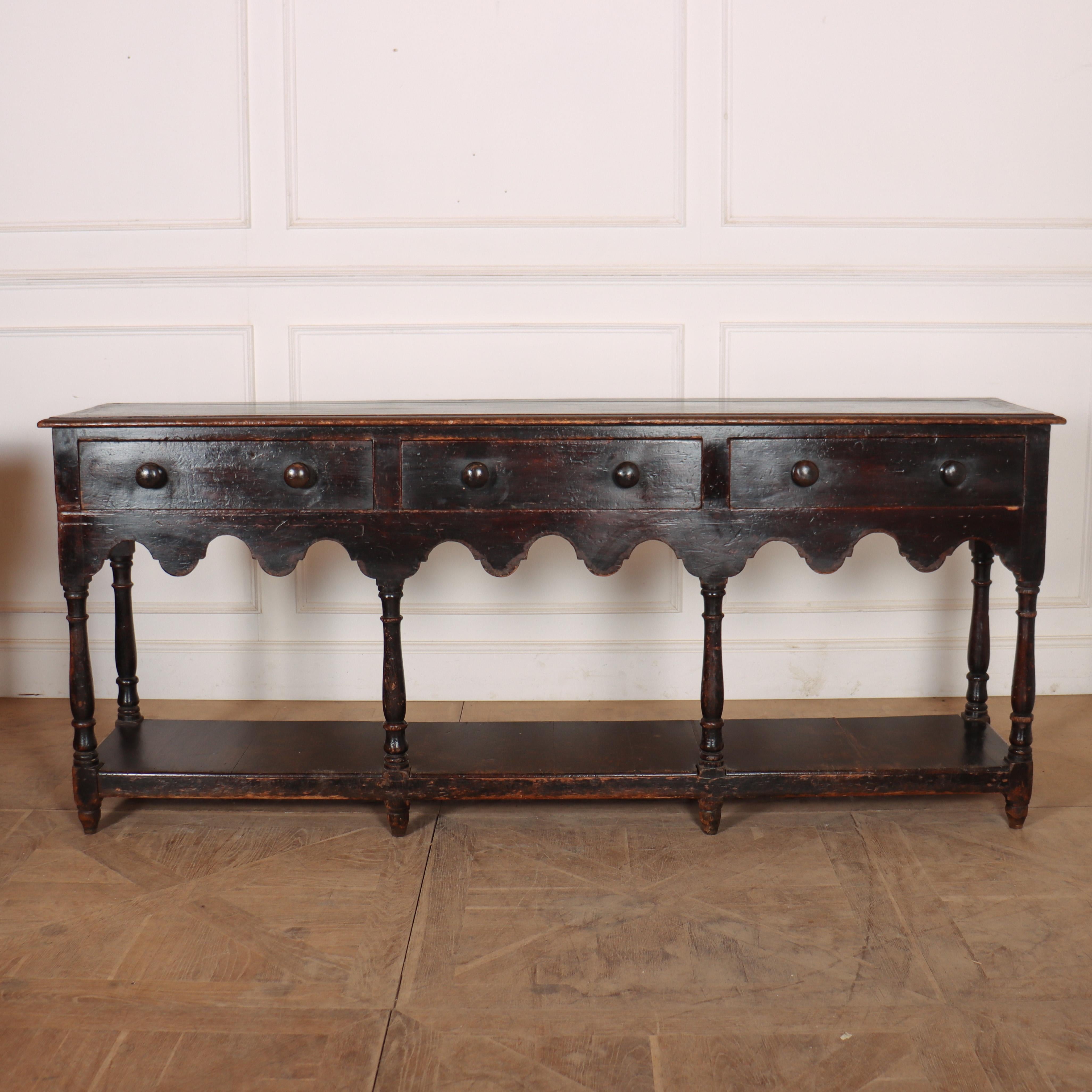 Wonderful early 19th C Welsh patinated pine dresser base with an old paint finish and good proportions. 1810.

Reference: 8401

Dimensions
83 inches (211 cms) Wide
18 inches (46 cms) Deep
35.5 inches (90 cms) High