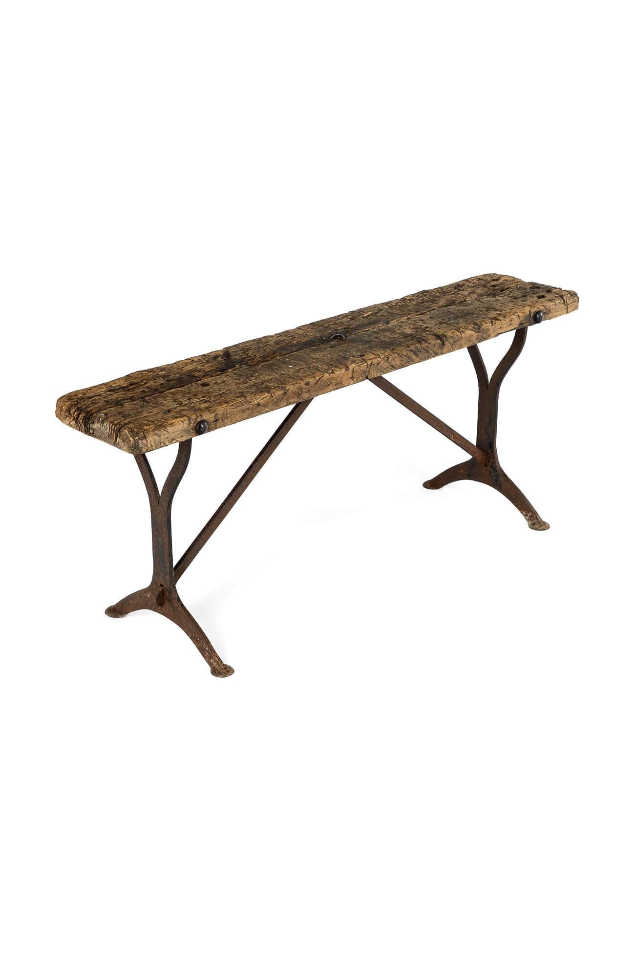 A weathered Welsh mid-19th-century pig bench.

Large single slab sycamore top with cast iron legs supported with diagonal and crescent supports on pad feet.

In original condition displaying heavy use and patination throughout with honest historical