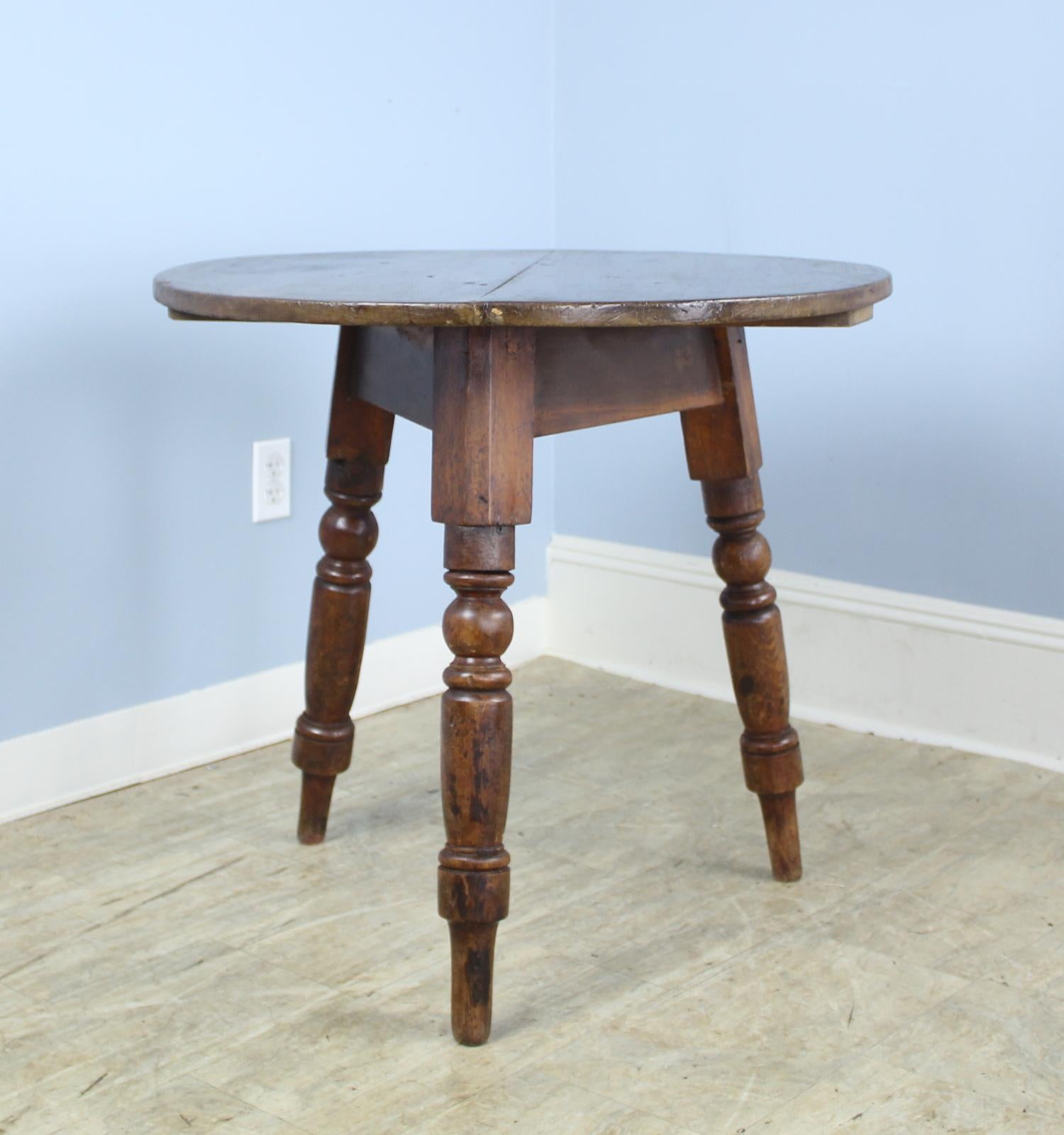 A classic Welsh pine cricket table with chunky turned legs.