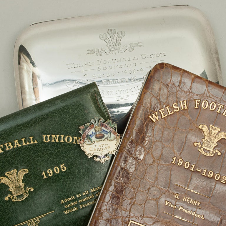 Four rare items once belonging to the Welsh Rugby Union Vice-President, G. Henry.
These wonderful rare items belonged to the Welsh Rugby Union Vice-President, G. Henry and comprise of a 1896 lapel-pin (medal), leather crocodile wallet (season