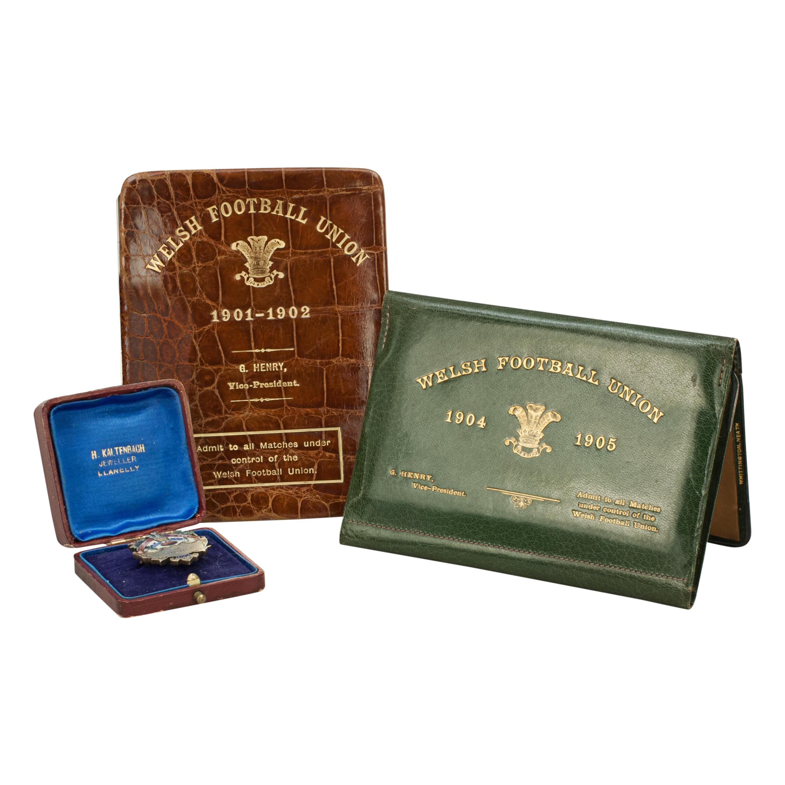 Three Rare Items Once belonging To The Welsh Rugby Union Vice-President, G. Henry.
These wonderful rare items belonged to the Welsh Rugby Union Vice-President, G. Henry and comprise of a 1896 lapel-pin (medal), leather crocodile wallet (season