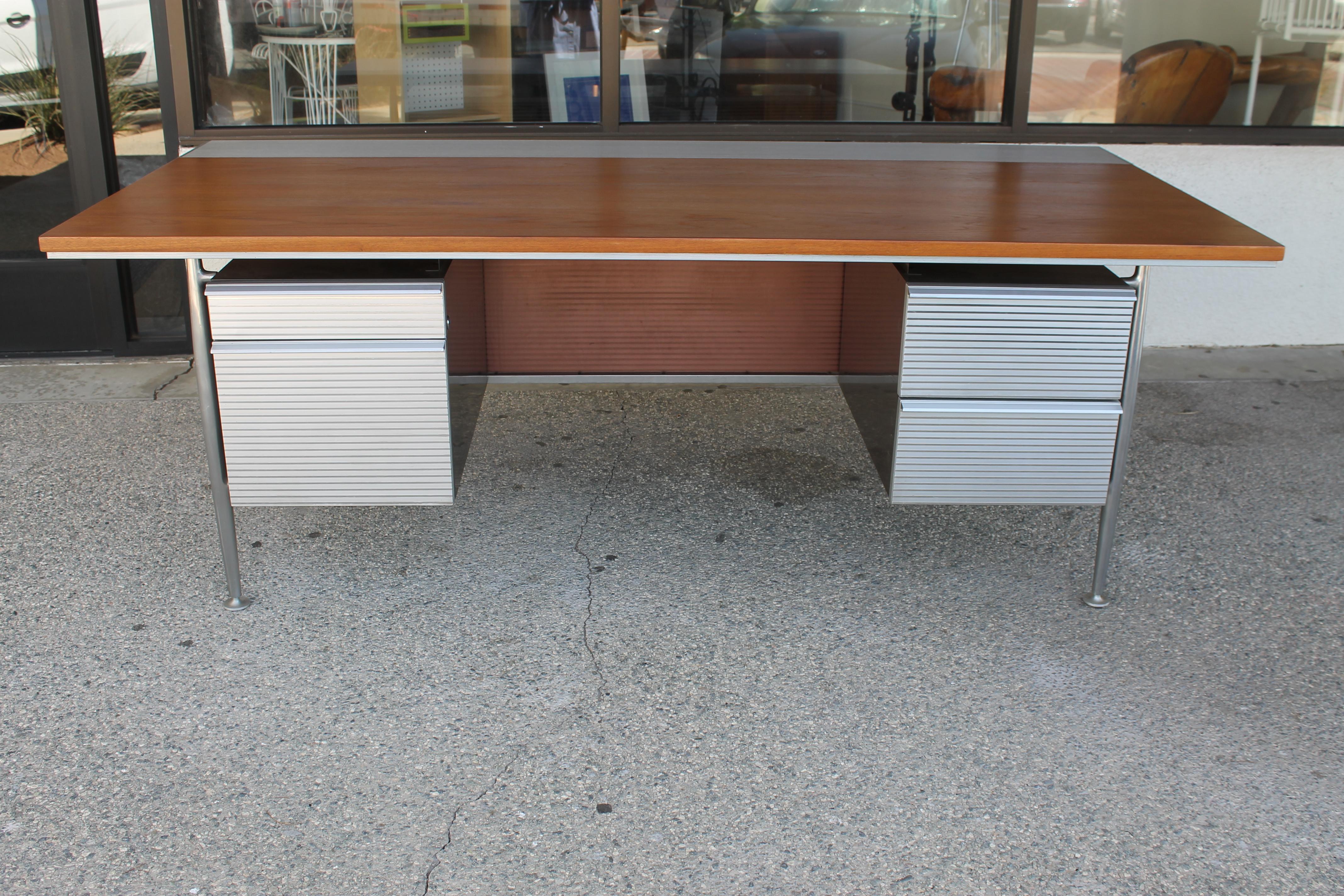 Welton Becket desk for Kaiser Aluminum. Desk is in pristine condition. We just lightly refinished the top. Desk measures: 80