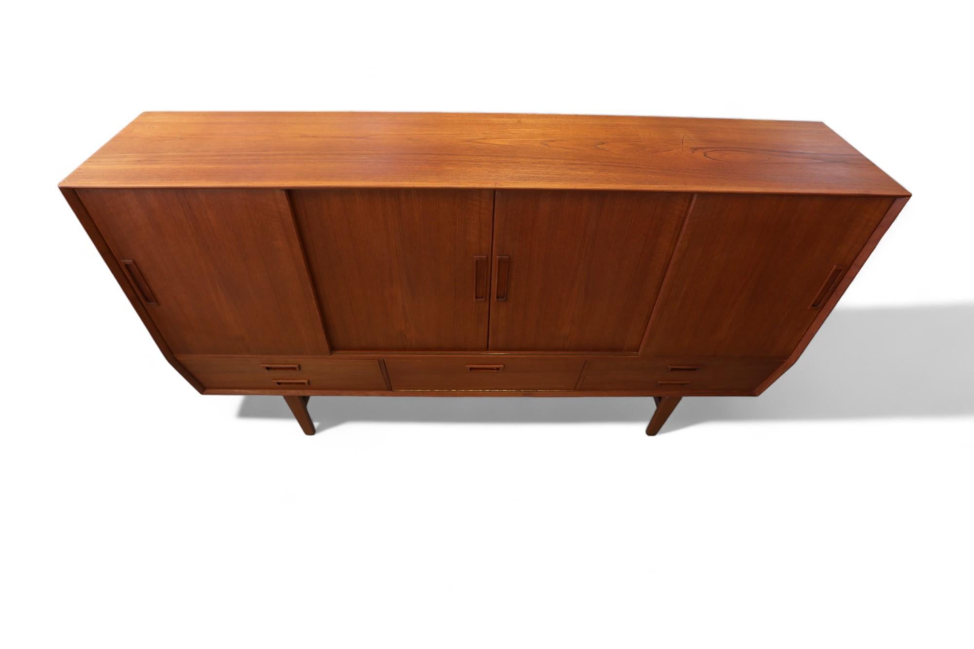 Scandinavian Modern Wemb Møbelfabrik sideboard in teak with illuminated bar cabinet. For Sale