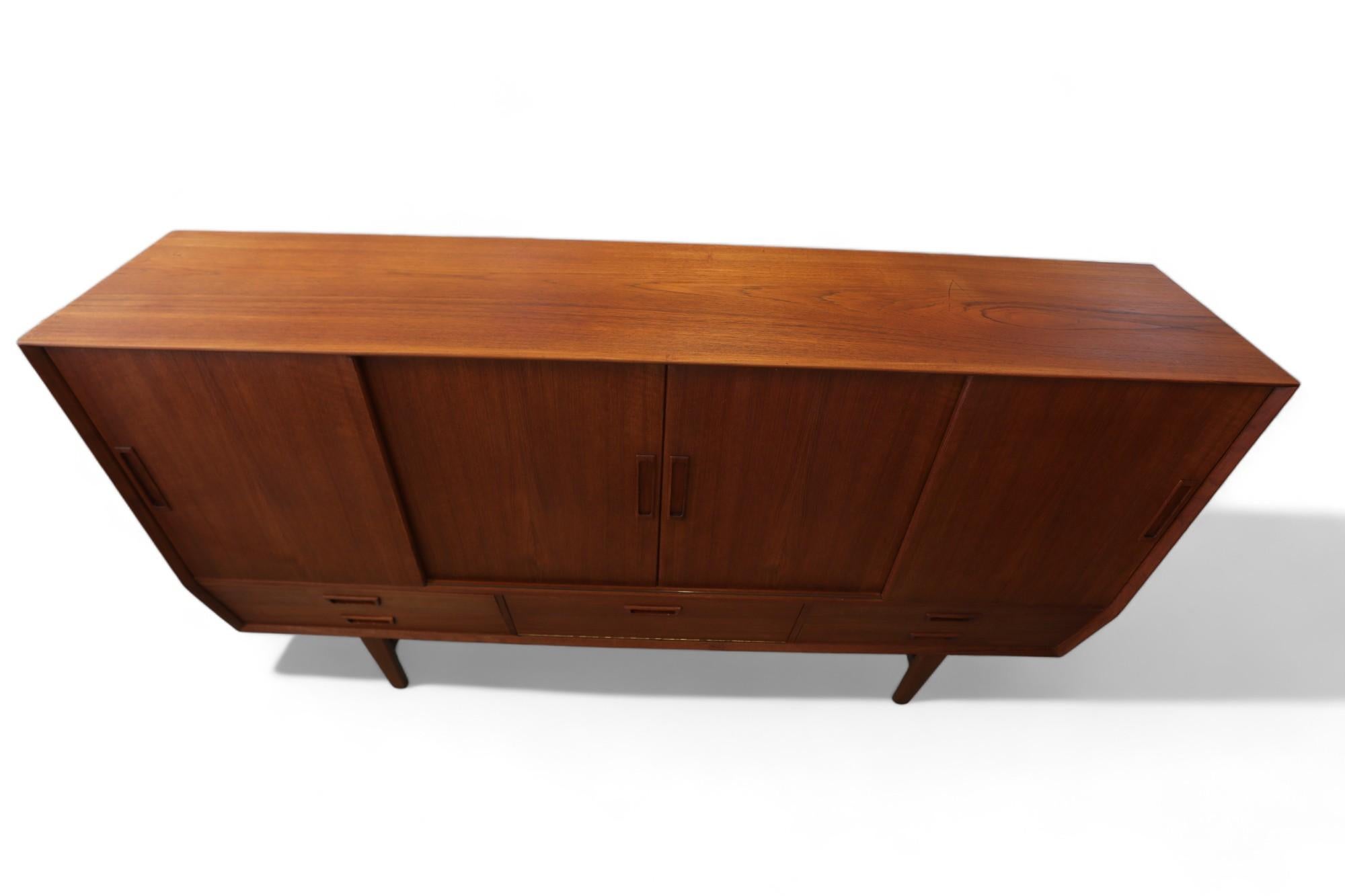 Mid-20th Century Wemb Møbelfabrik sideboard in teak with illuminated bar cabinet. For Sale