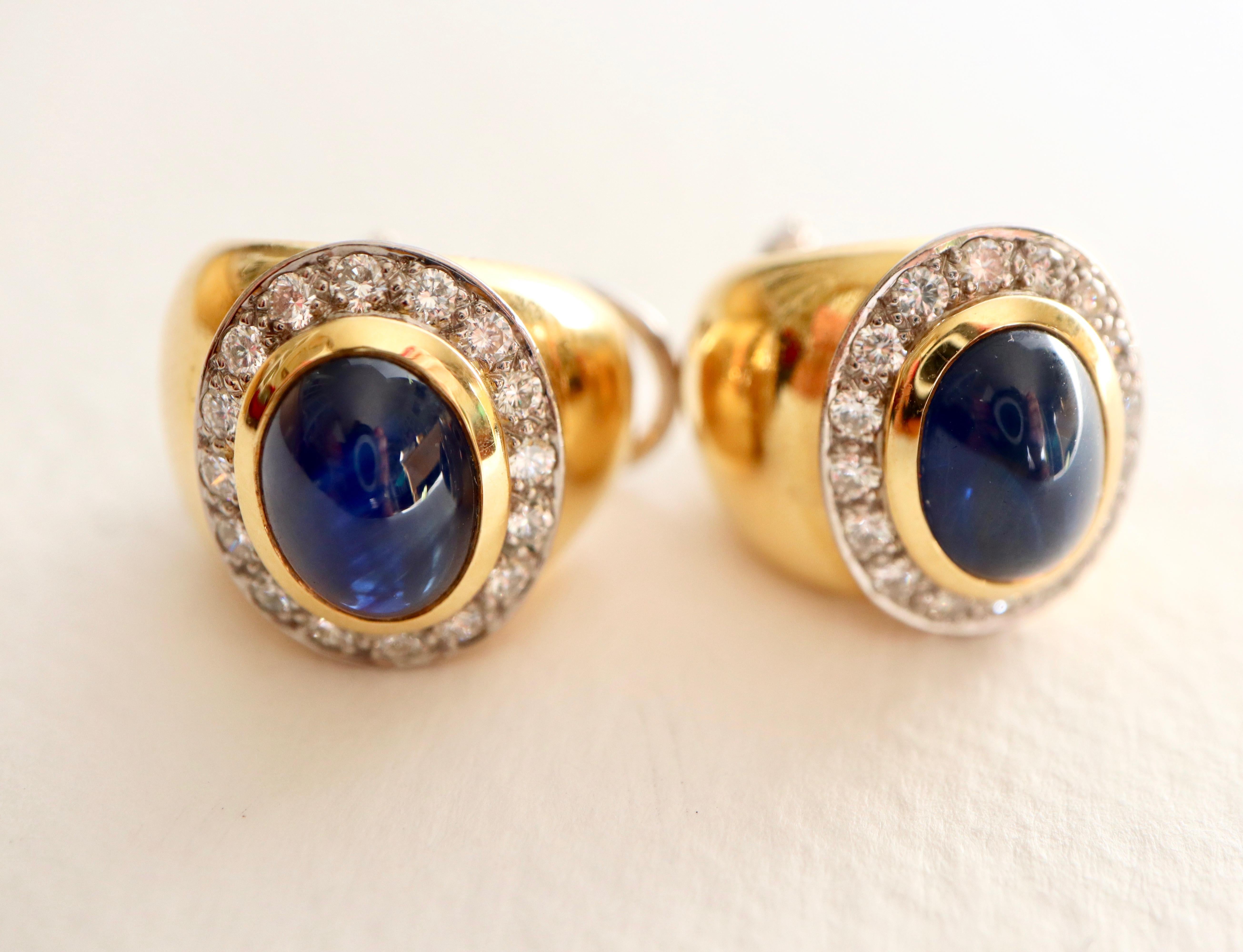 WEMPE 18 Carat yellow Gold and white Gold Earrings set with a Cabochon Sapphire each with Diamond entourage for pierced Ears but we can take off the adds if you want them for non pierced Ears.
Signed W and numbered 
Dimensions of Sapphires 9 x 6.5