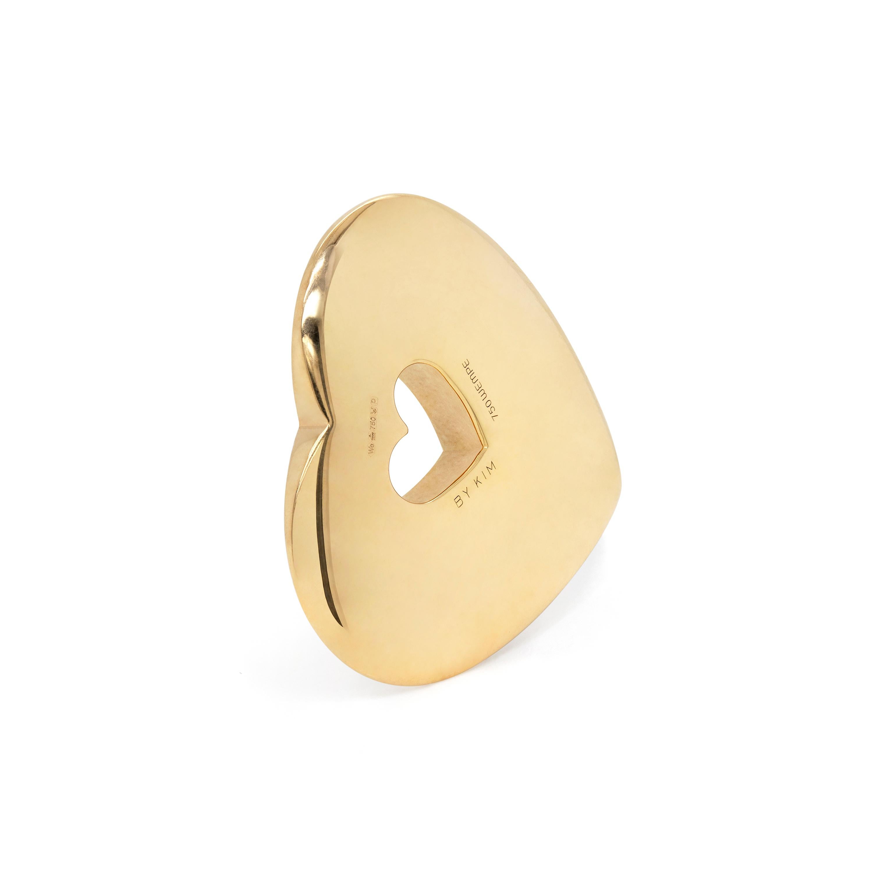 This stunning pendant by famous London jewellers, WEMPE is a solid 18 carat yellow gold heart with a heart cut out in the centre. The piece is engraved ‘AMOR MANET’ with the ‘O’ invisible set with a round brilliant cut diamond, estimated to weigh