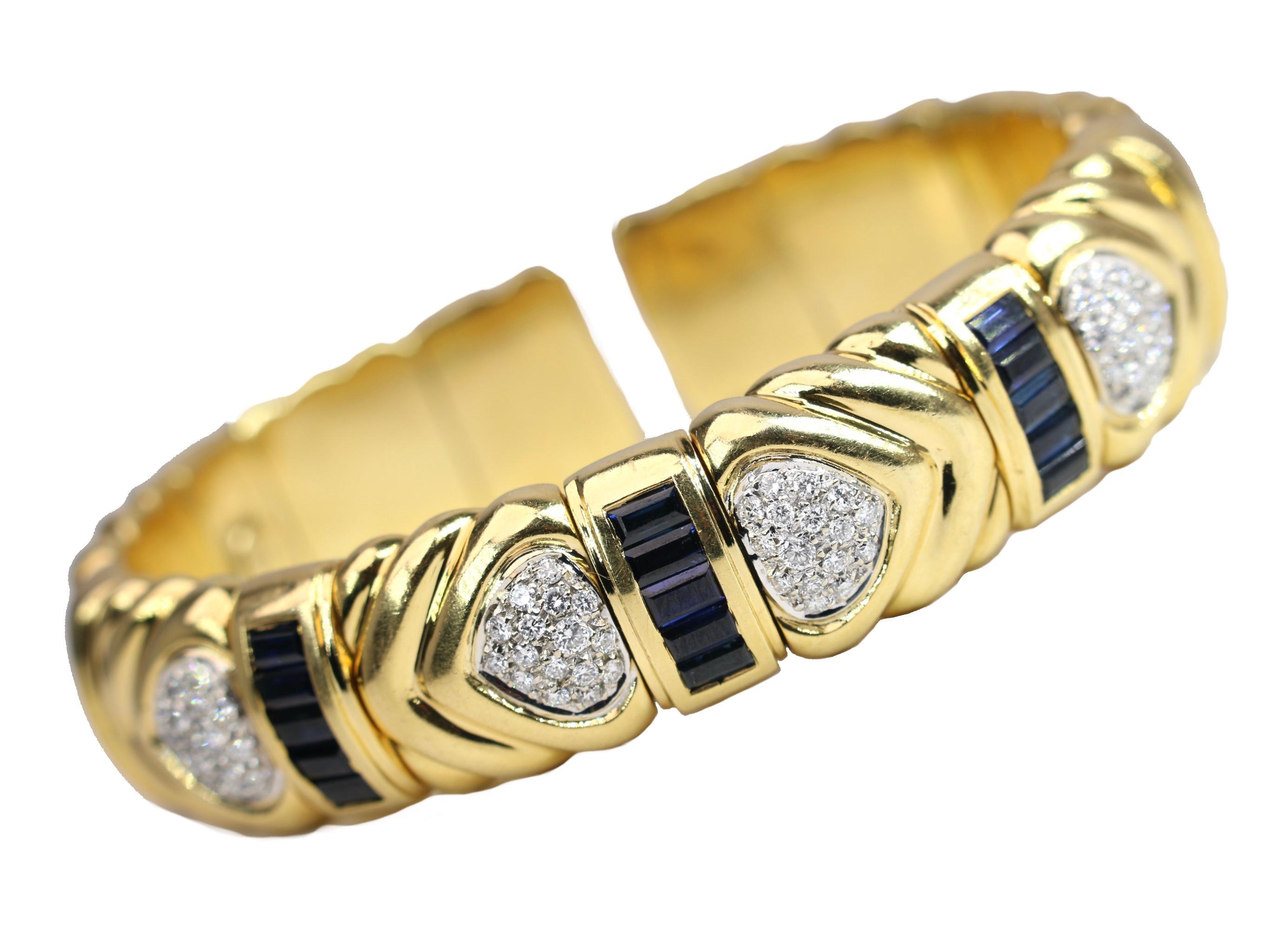 Wempe 18K cuff with sapphires and diamonds.  Expandable cuff.  Diameter is 6 inches. 
69.9 Grams
.5