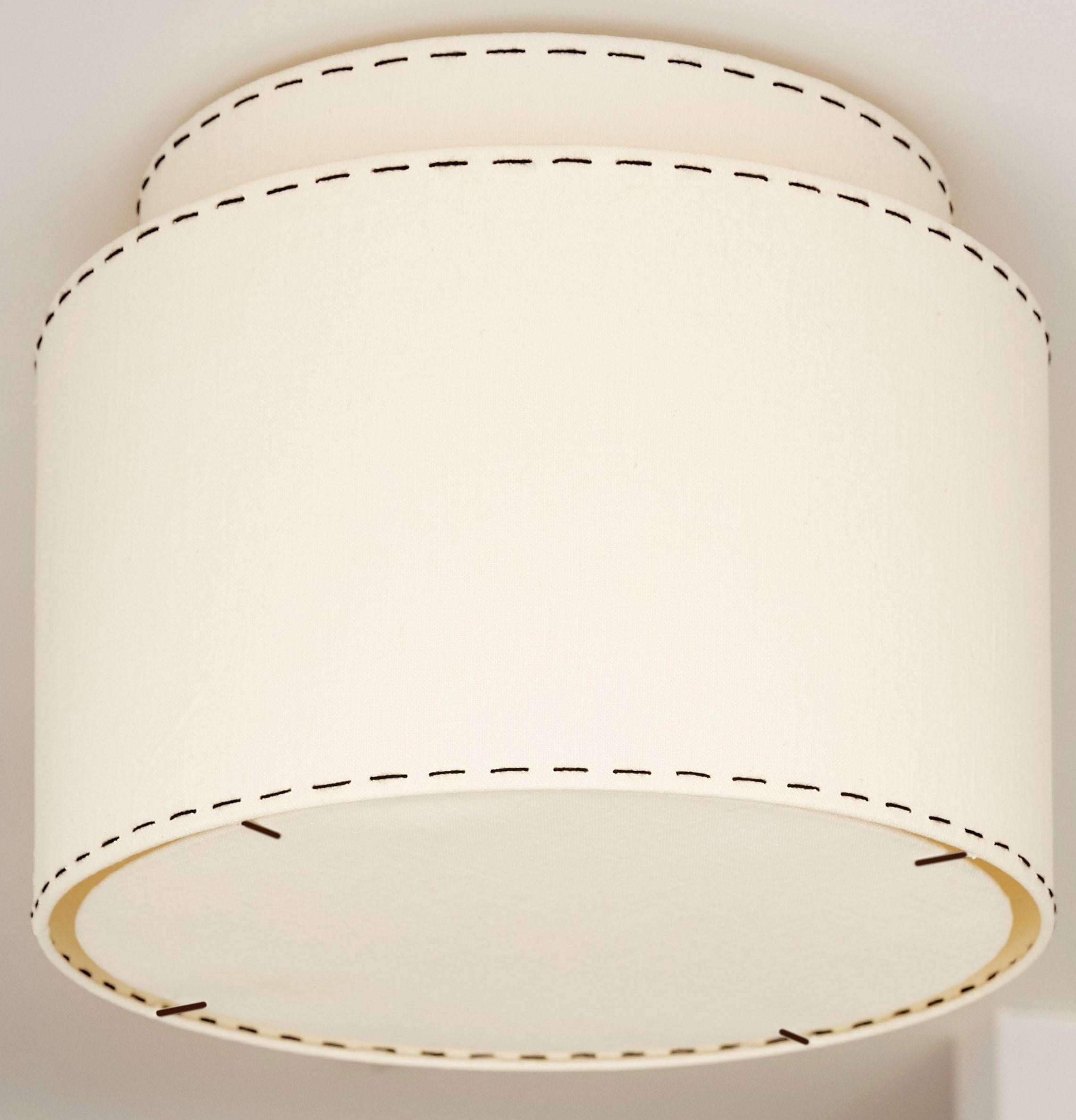 We're happy to send Italian and Belgian linen cuttings for our lights at no charge for the samples. This is the payment portal for the international express charge to send.  We can include a number of linen samples for the same price.  Larger finish