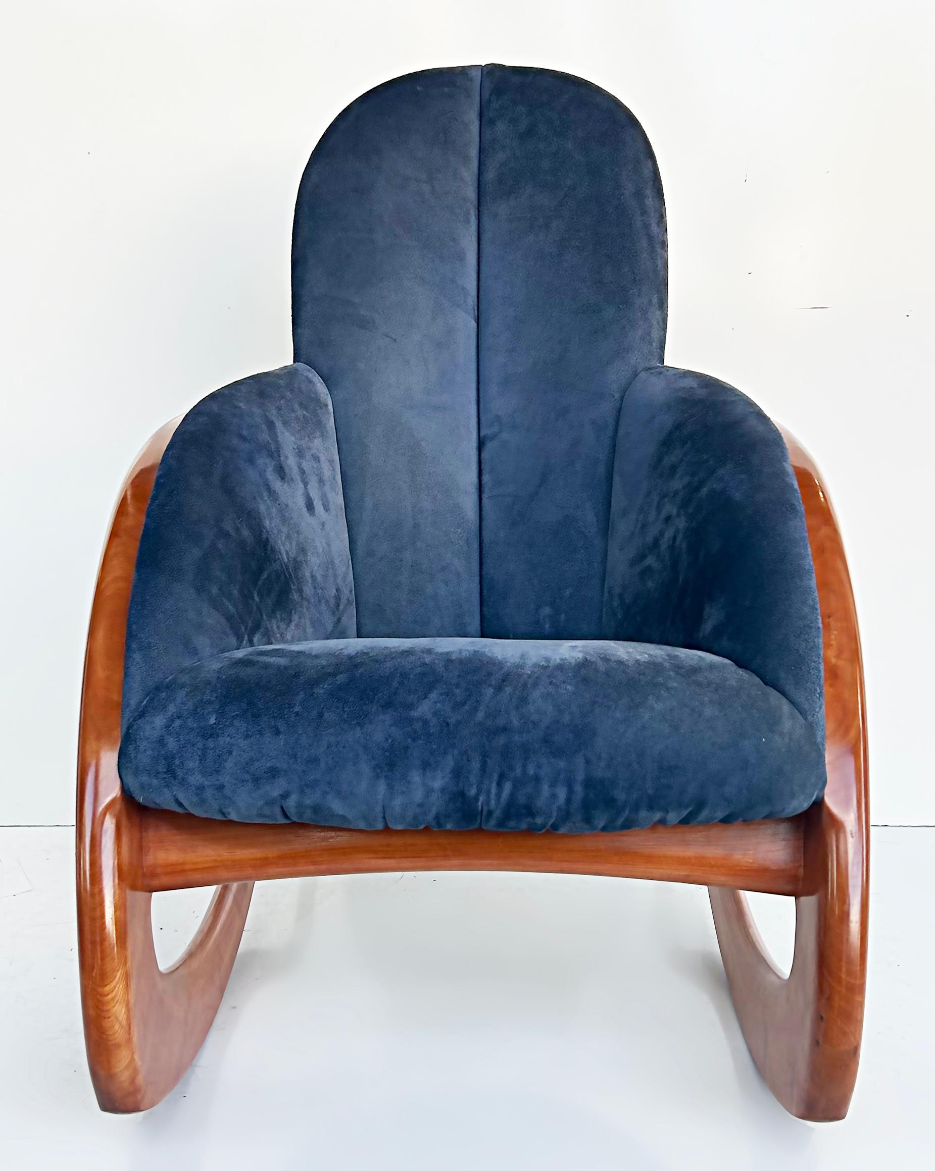 Wendell Castle crescent moon wood and suede rocking chair.

Offered for sale is a Wendell Castle ( 1932–2018) 